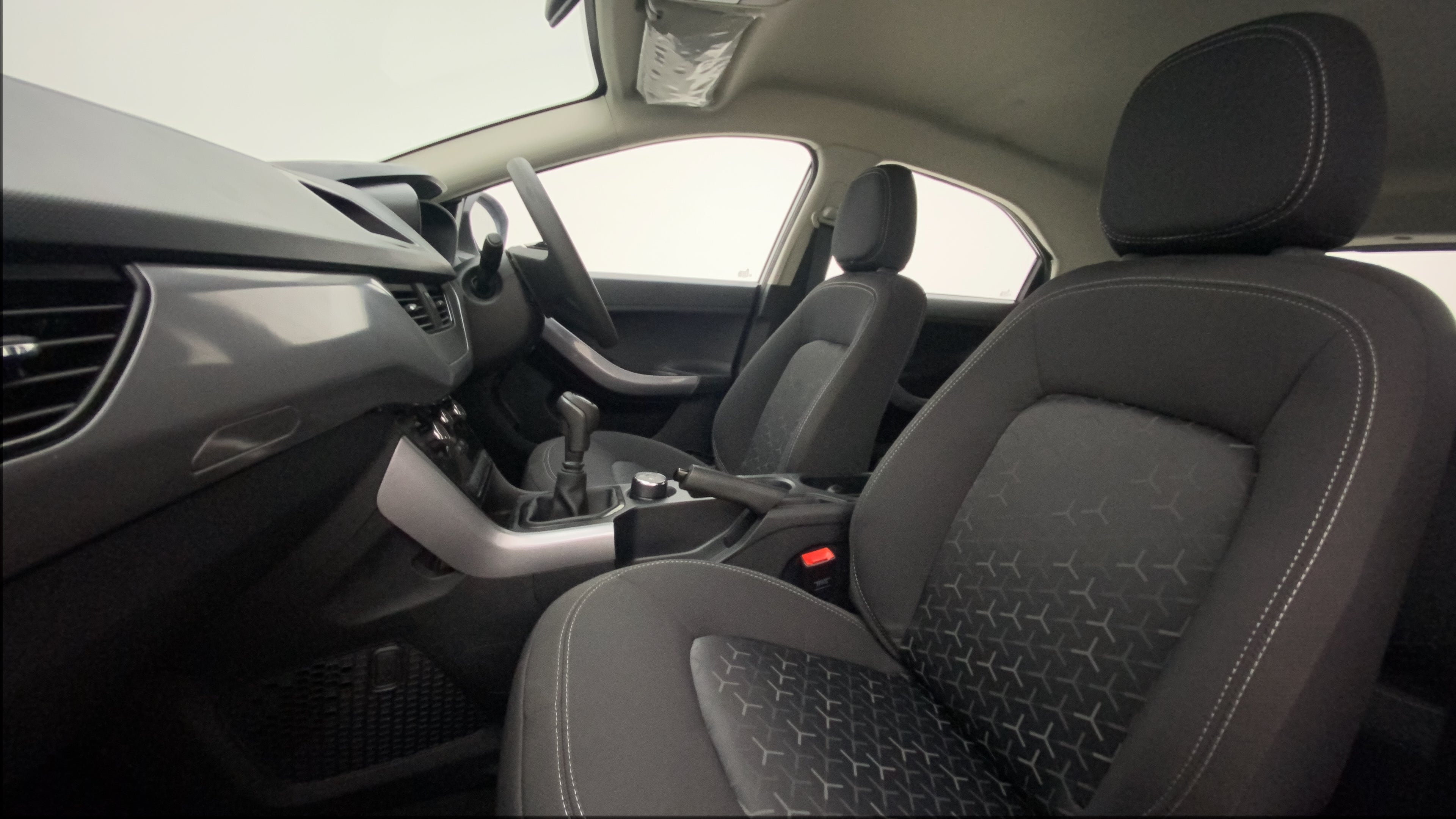 Interior dashboard and front seats of a Tata Nexon 2017-2023