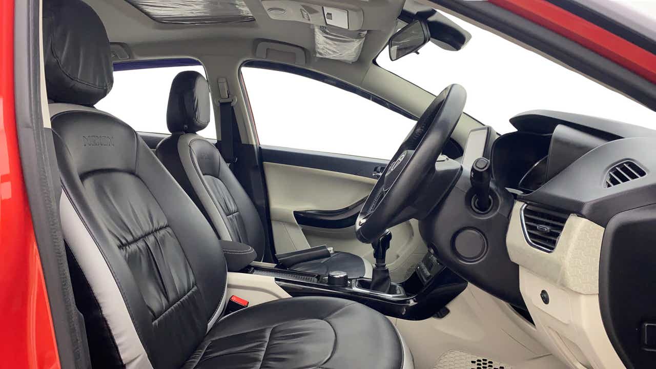 Interior front seats and dashboard of a Tata Nexon 2017-2023