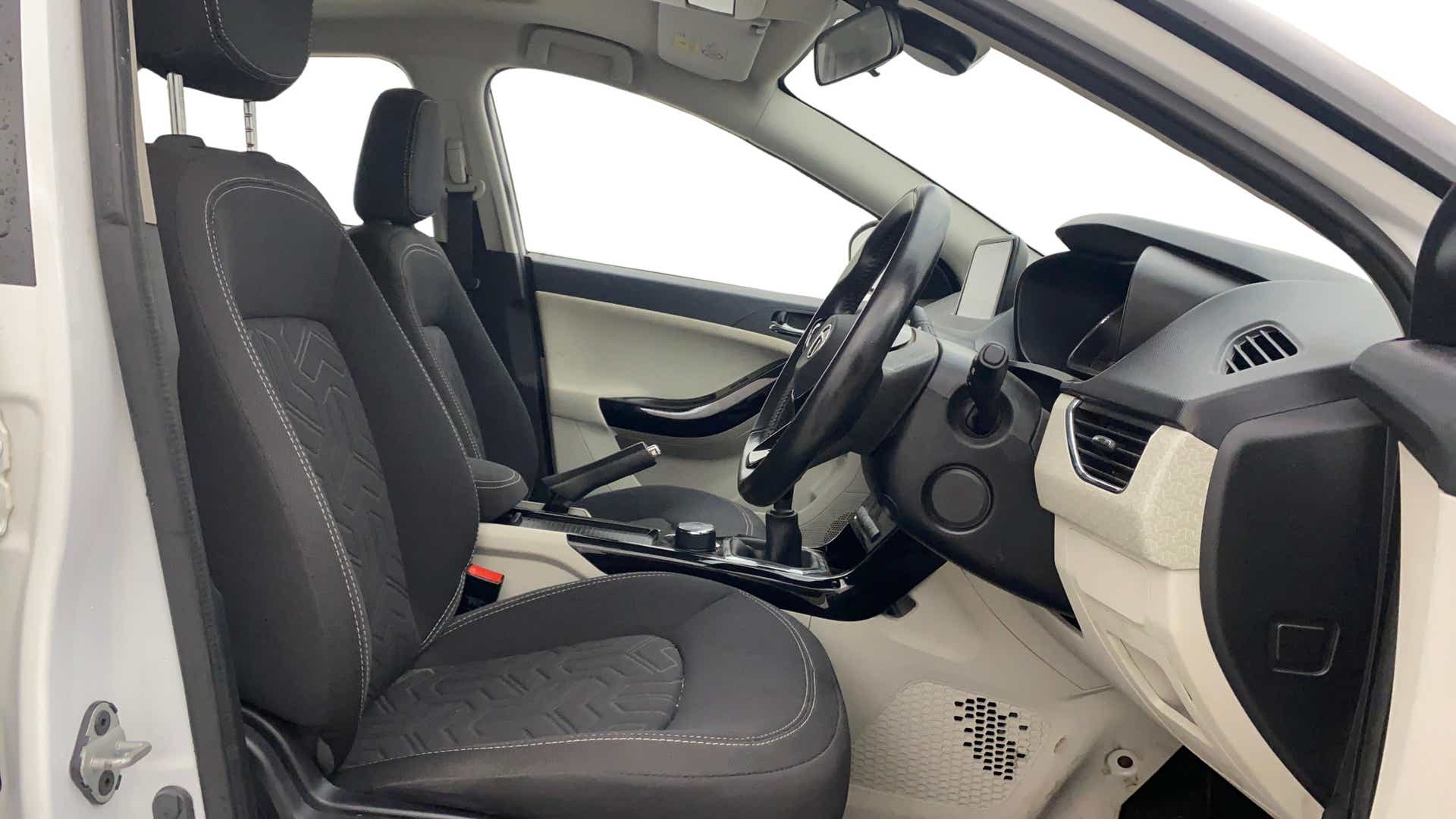 Interior front seats and dashboard of a Tata Nexon 2017-2023