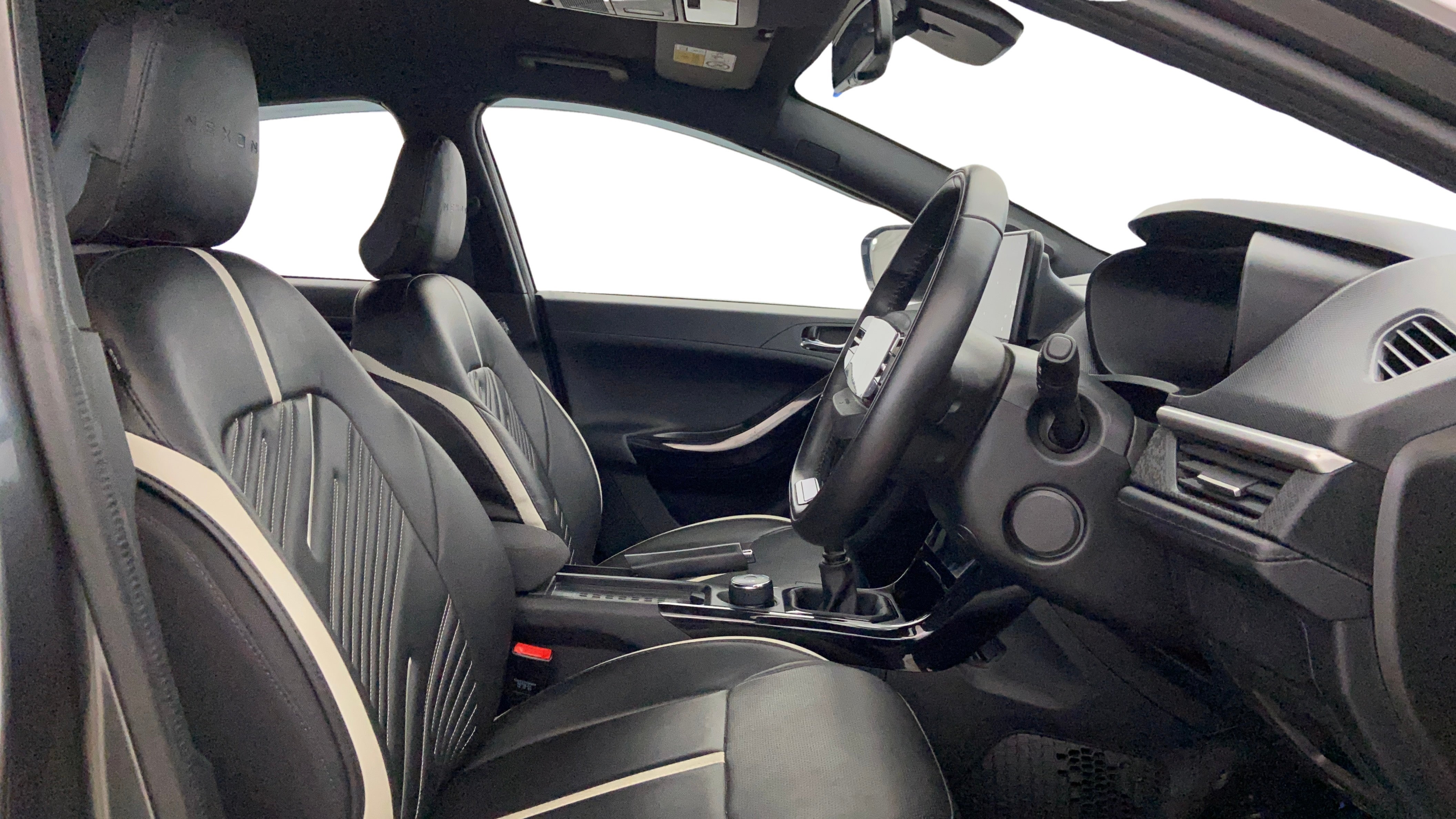 Interior front seats and dashboard of a Tata Nexon 2017-2023