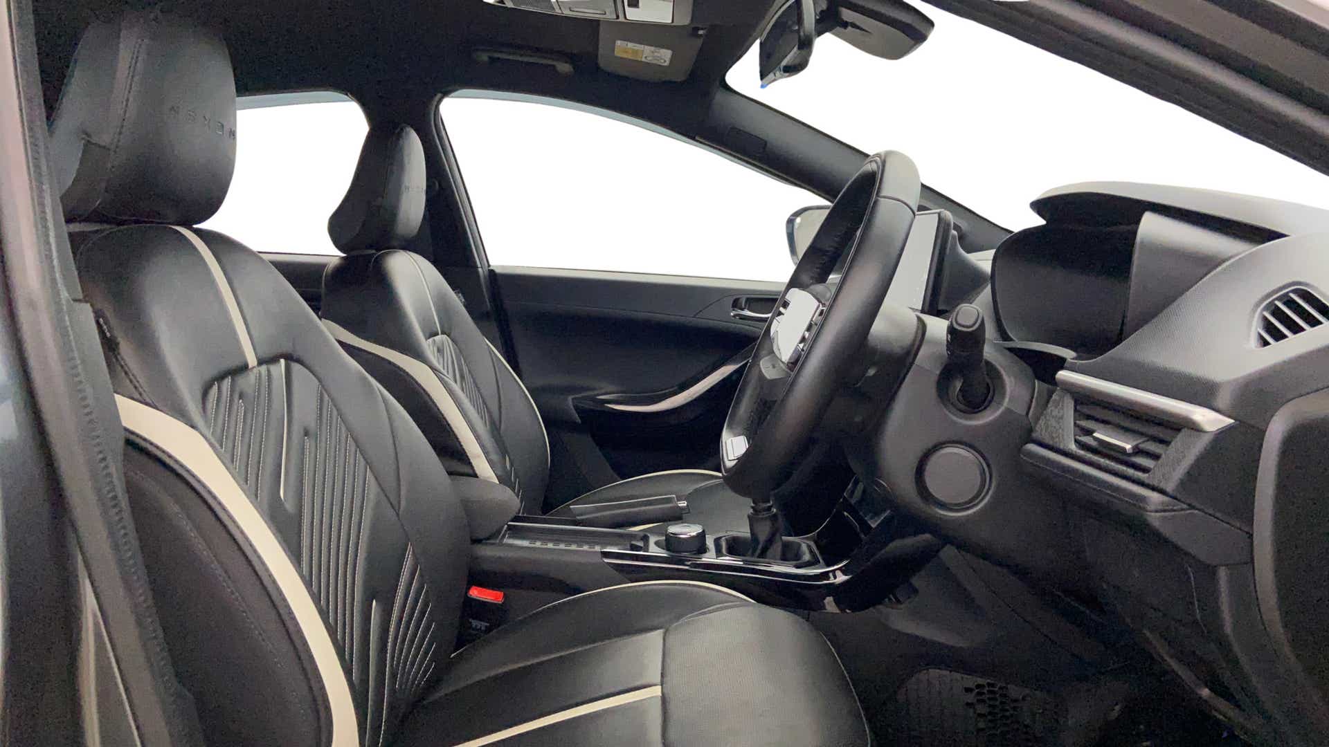 Interior front seats and dashboard of a Tata Nexon 2017-2023