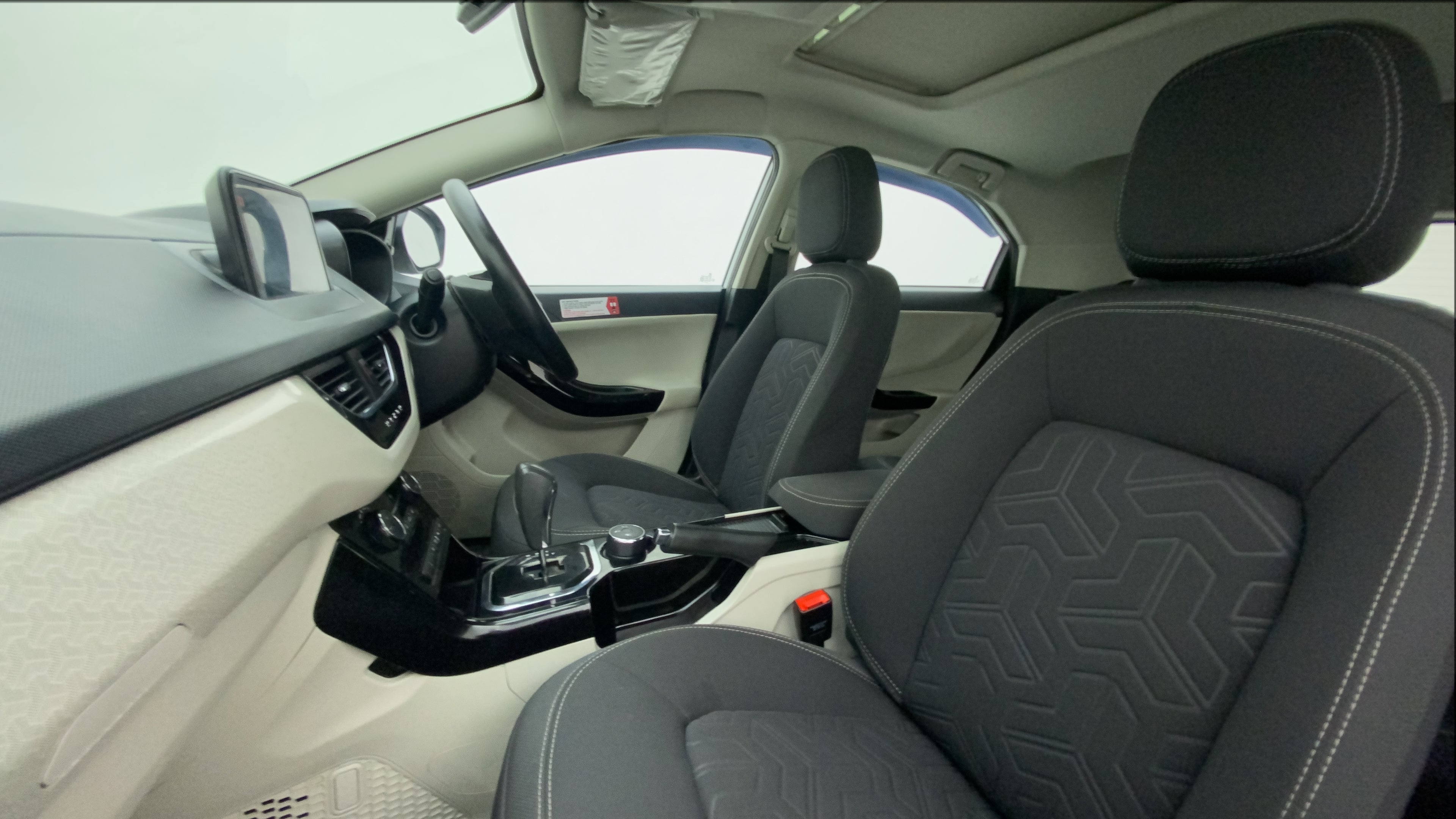 Interior dashboard and front seats of a Tata Nexon 2017-2023
