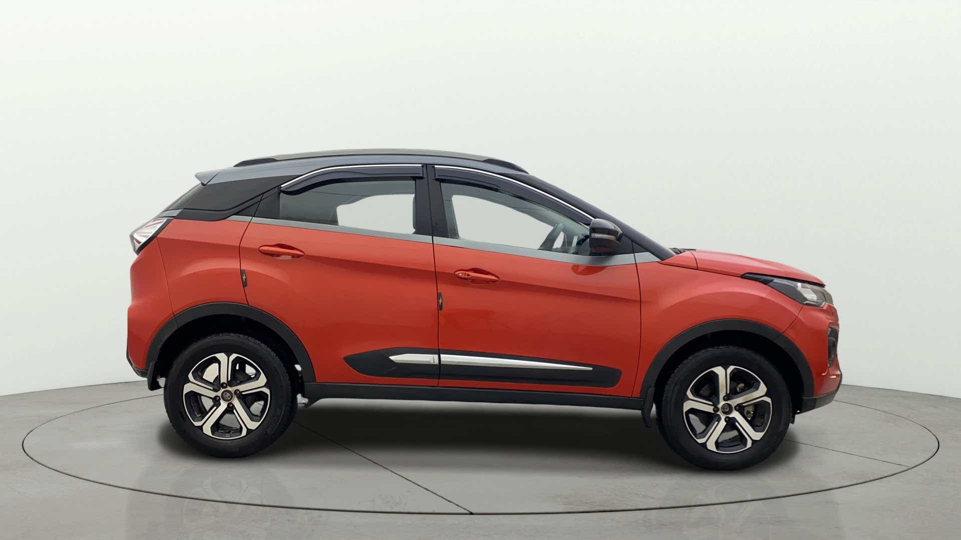 Side view of a Flame Red Tata Nexon 2017-2023
