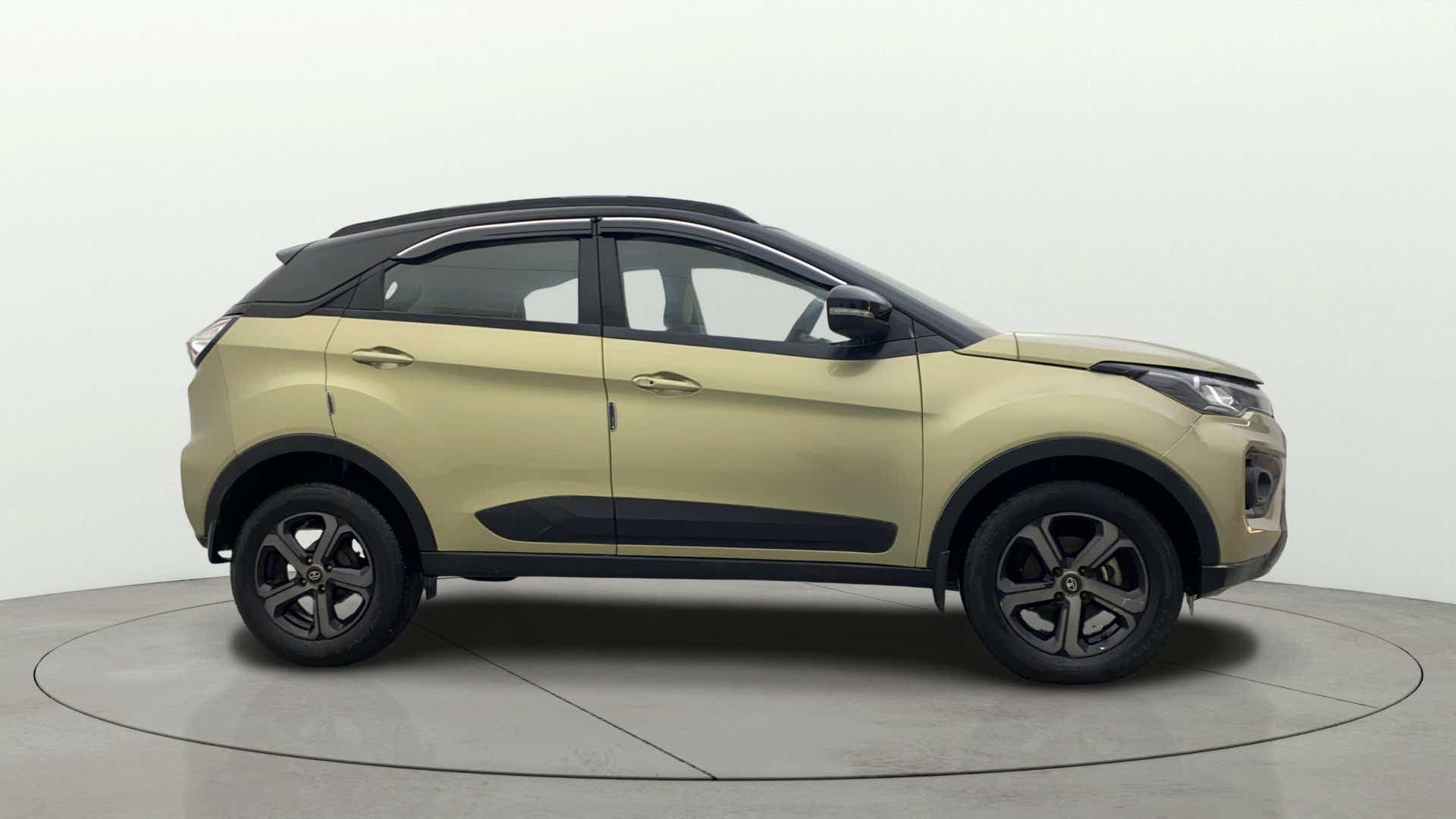 Side view of a Grassland Beige Tata Nexon 2017-2023