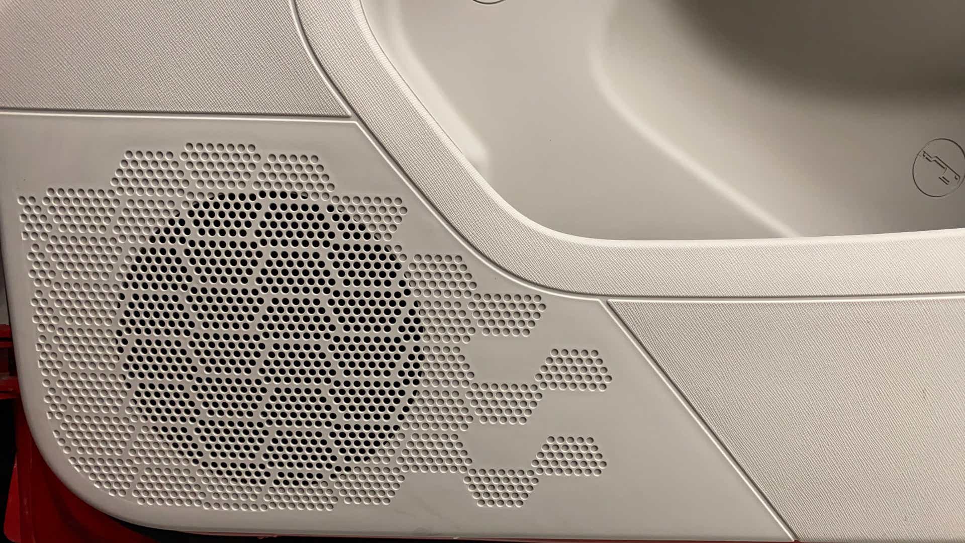 Close-up of a door speaker grille of a Tata Nexon 2017-2023