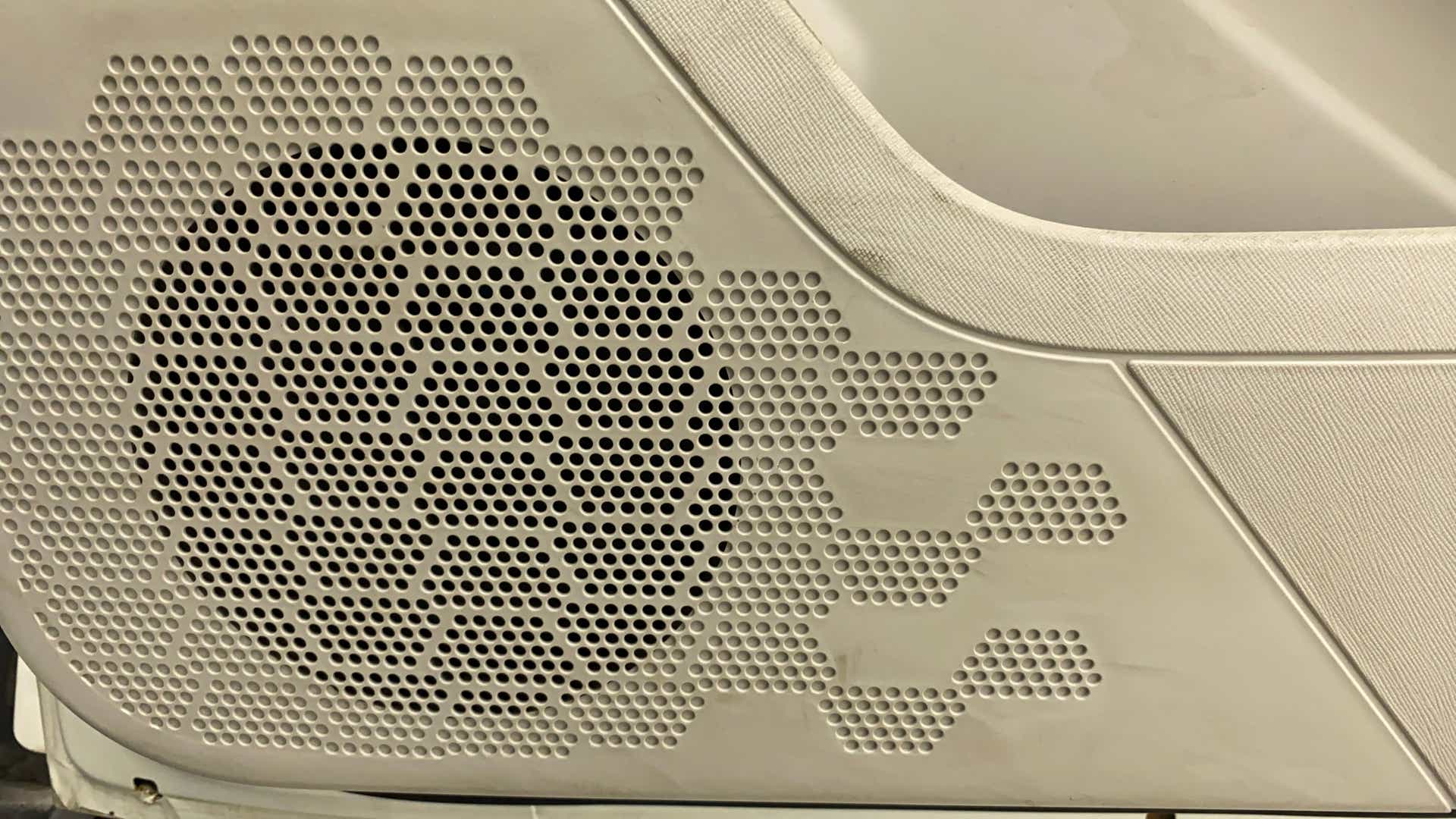 Close-up of the speaker grille in a Tata Nexon 2017-2023