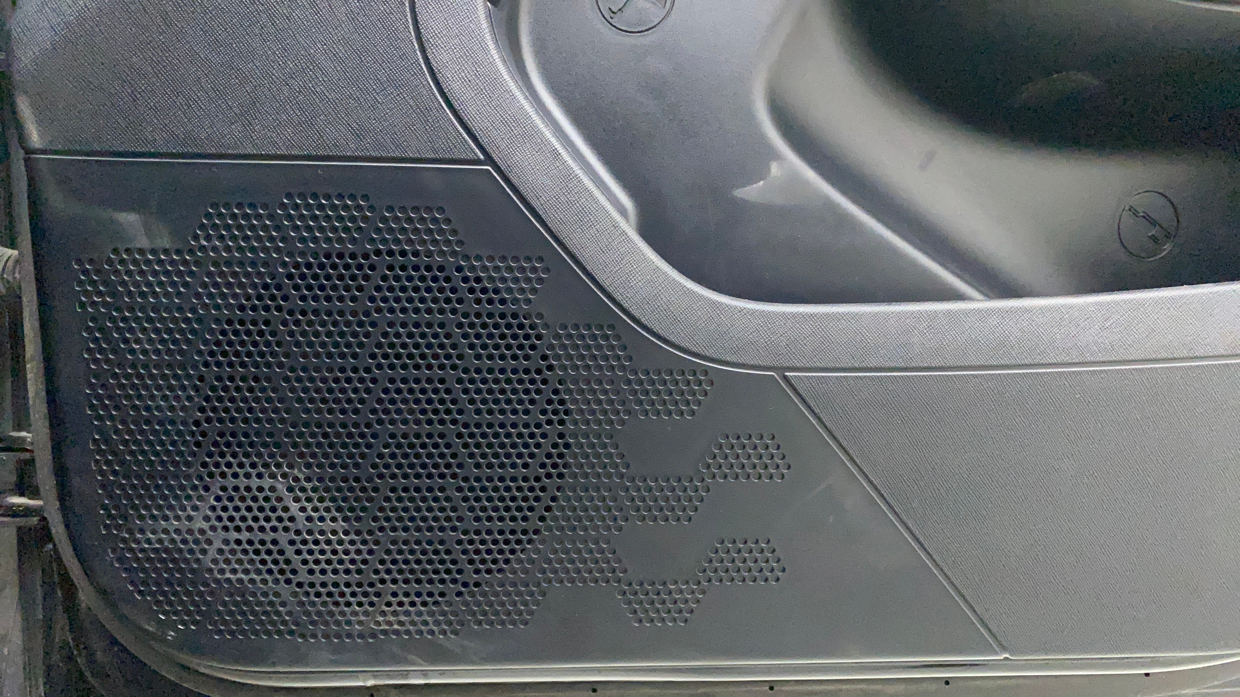 Speaker grille on the door panel of a Tata Nexon 2017-2023