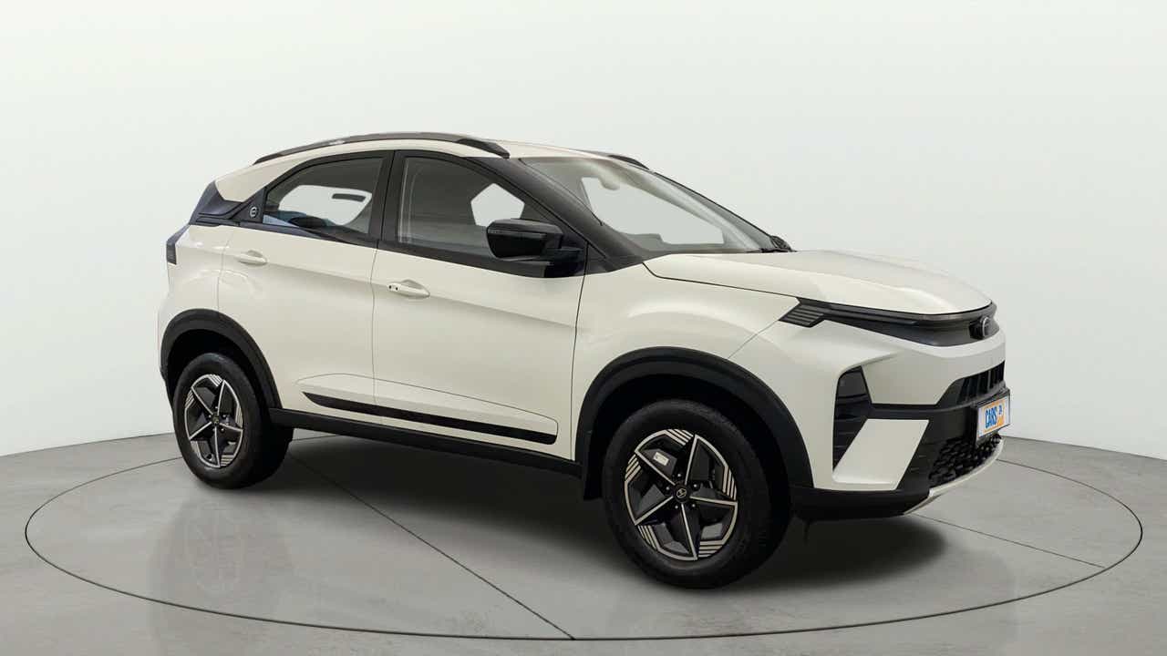 Side view of a Calgary White Tata Nexon