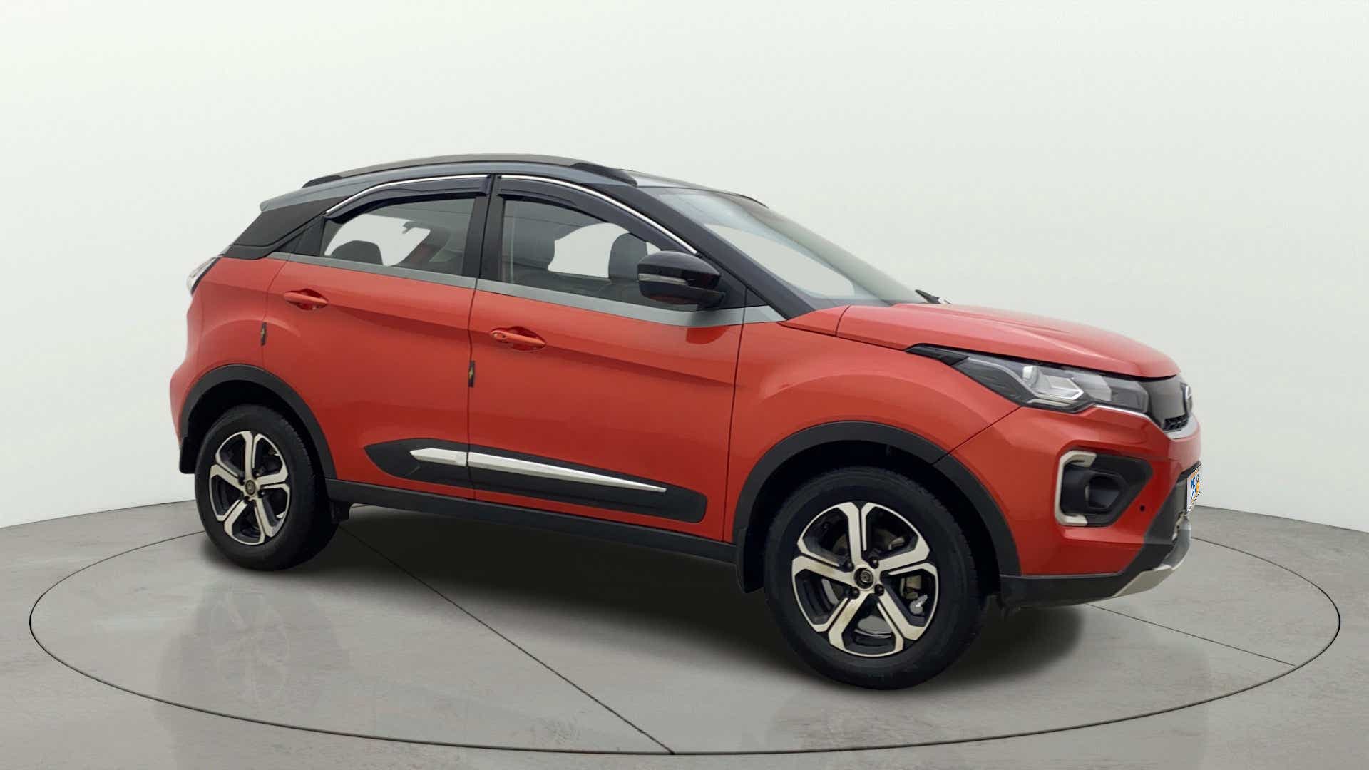 Side view of a Flame Red Tata Nexon 2017-2023