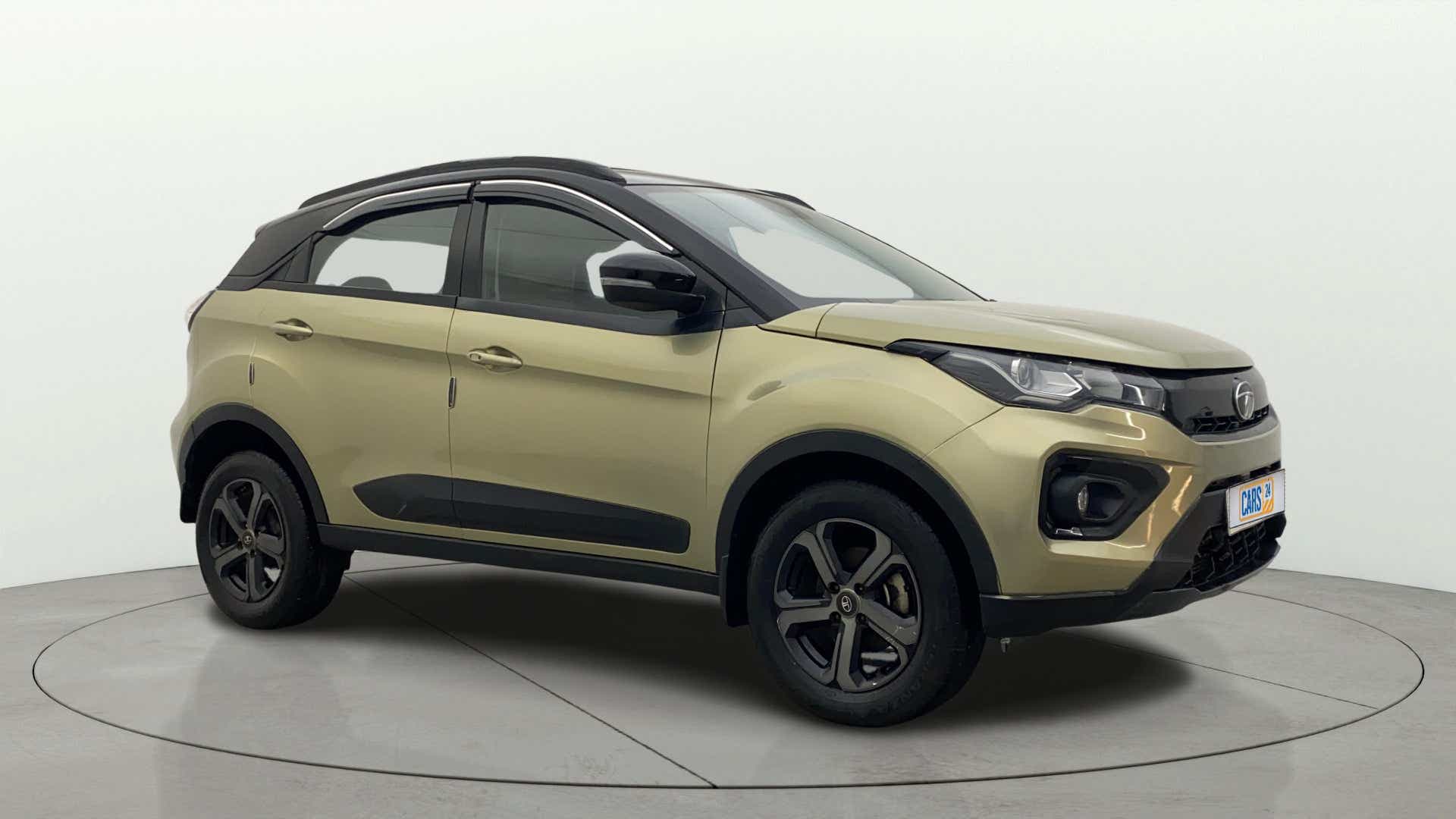 Front three-quarter view of a Grassland Beige Tata Nexon 2017-2023