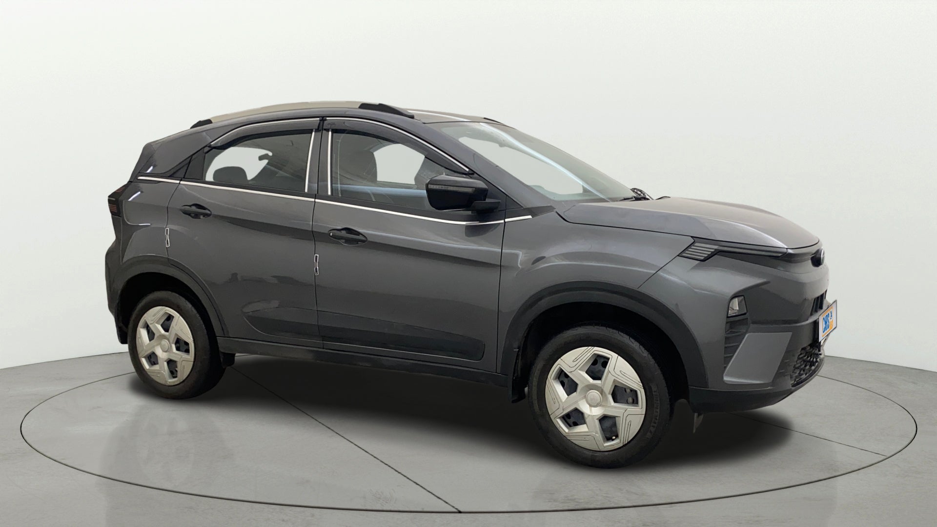 Side view of a daytona grey Tata Nexon