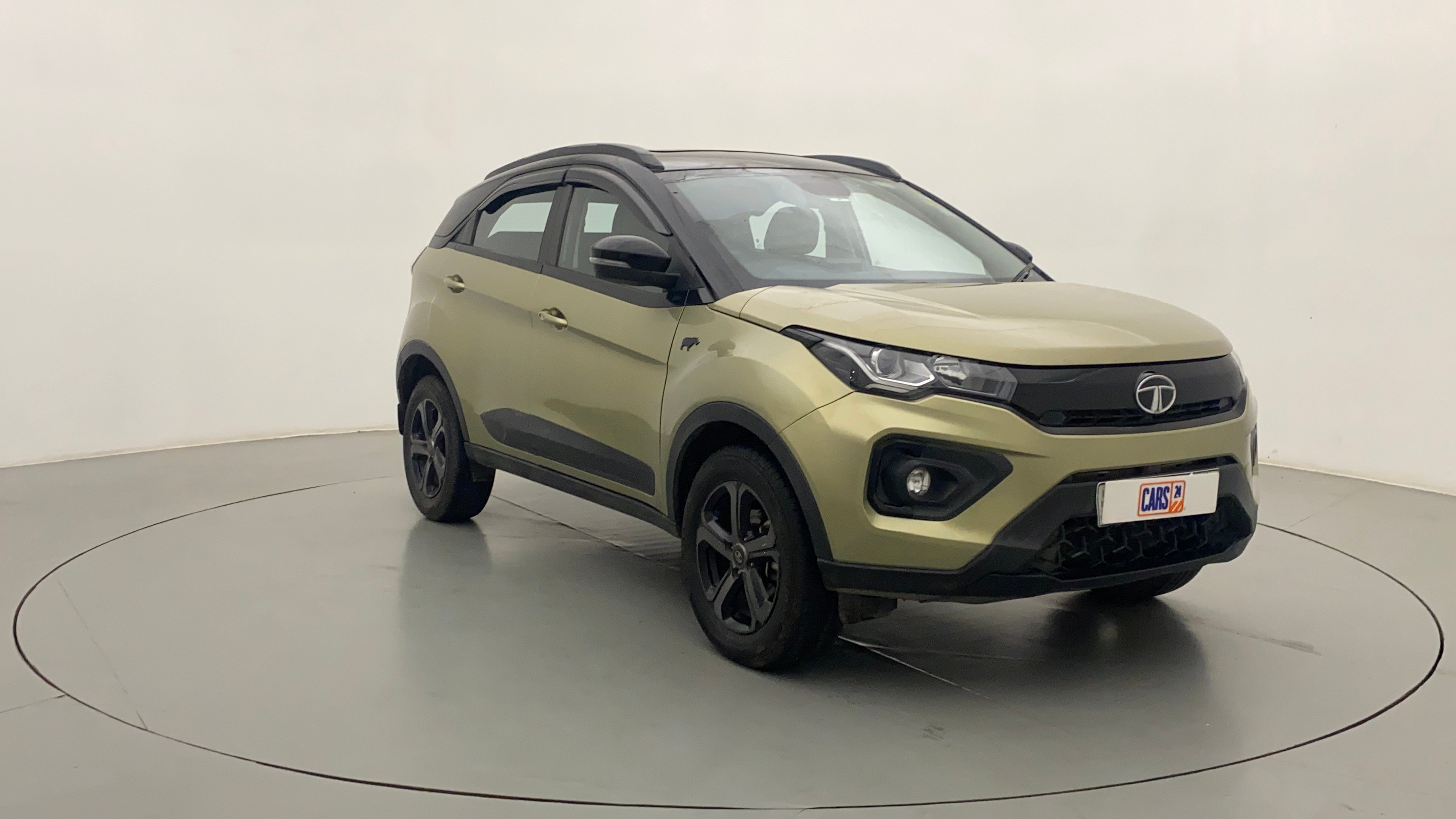 Front three-quarter view of a Grassland Beige Tata Nexon 2017-2023