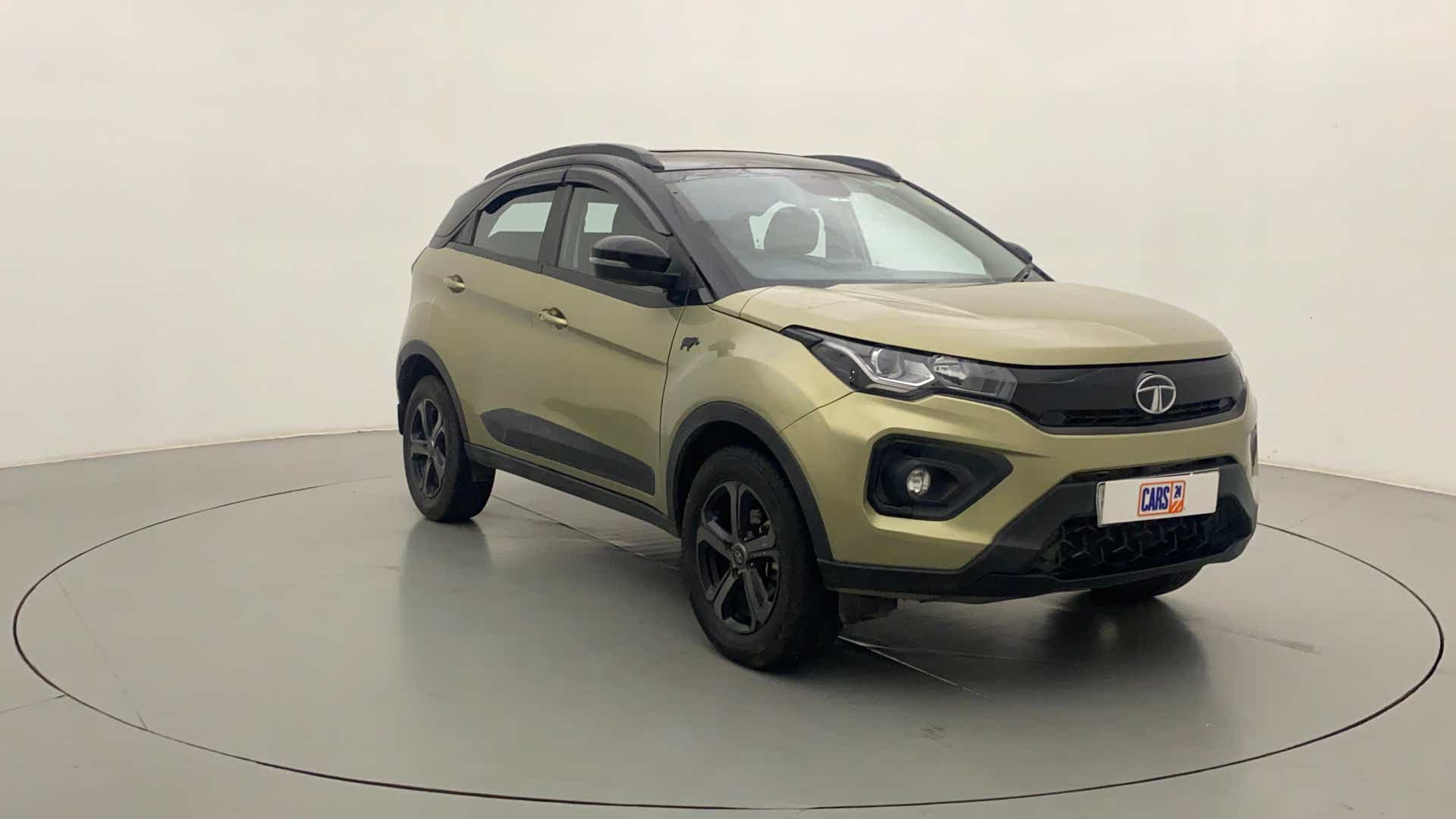 Front three-quarter view of a Grassland Beige Tata Nexon 2017-2023
