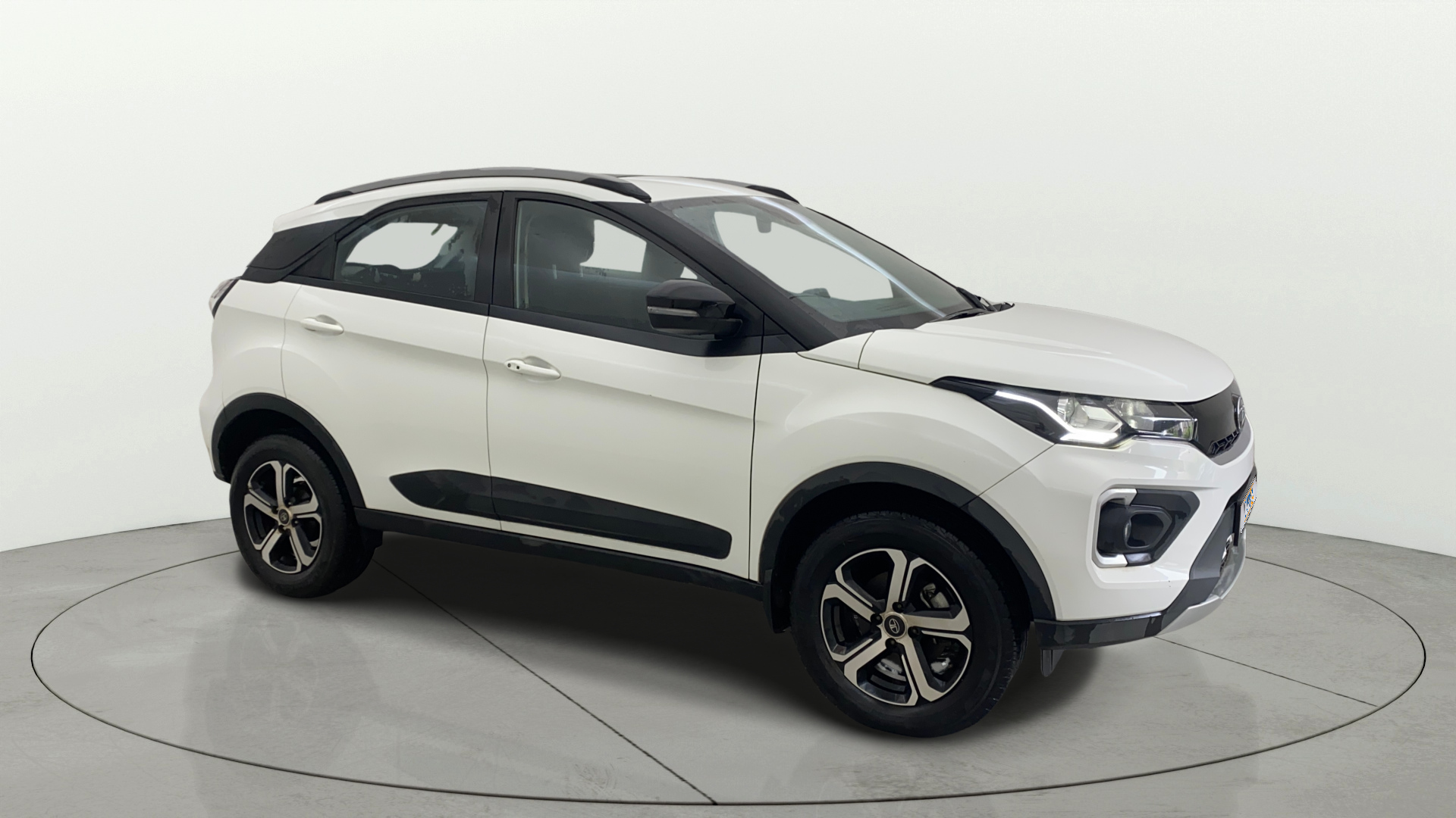 Front-side view of a Calgary White Tata Nexon 2017-2023