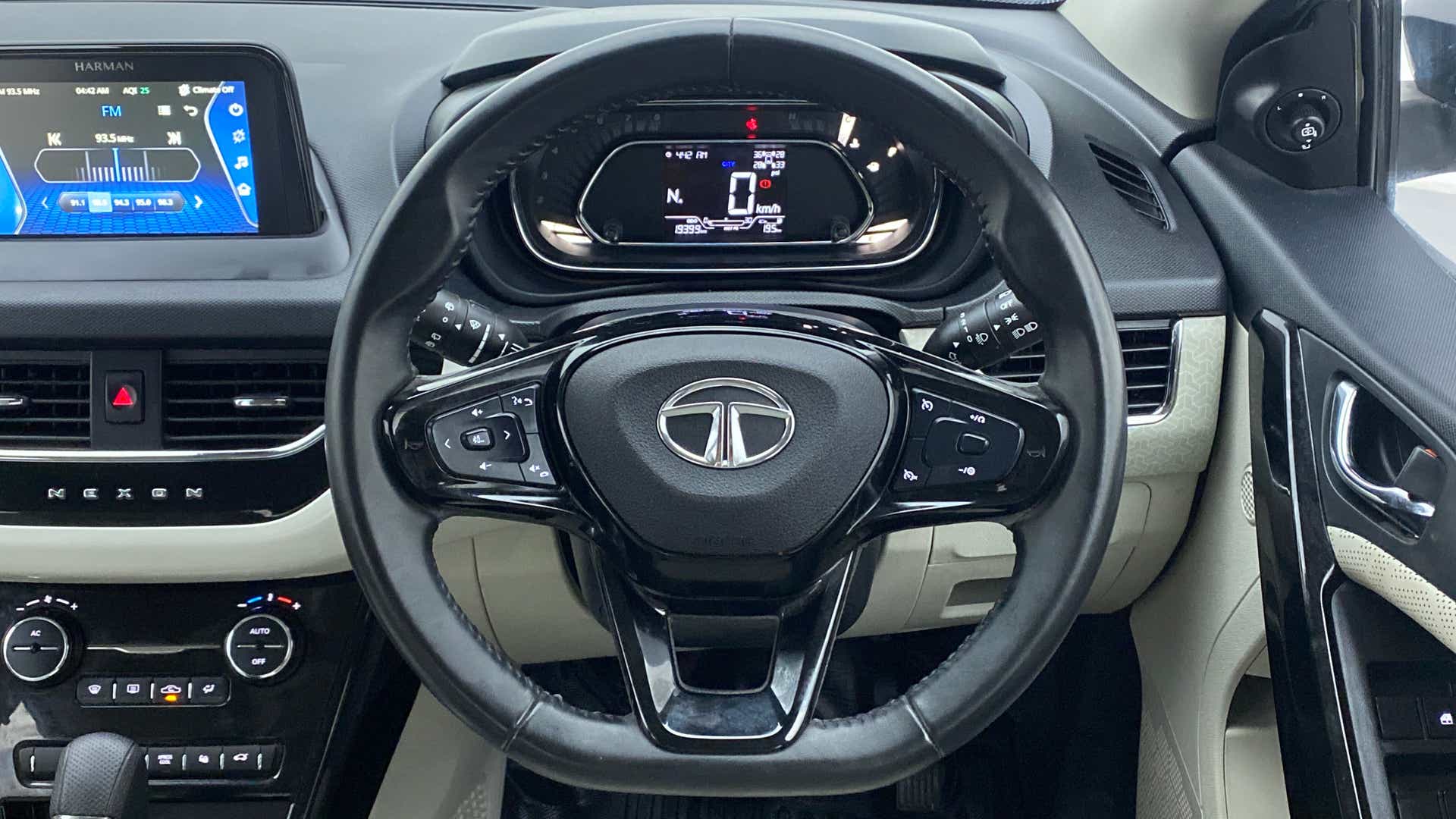 Steering wheel and dashboard view of a Tata Nexon 2017-2023