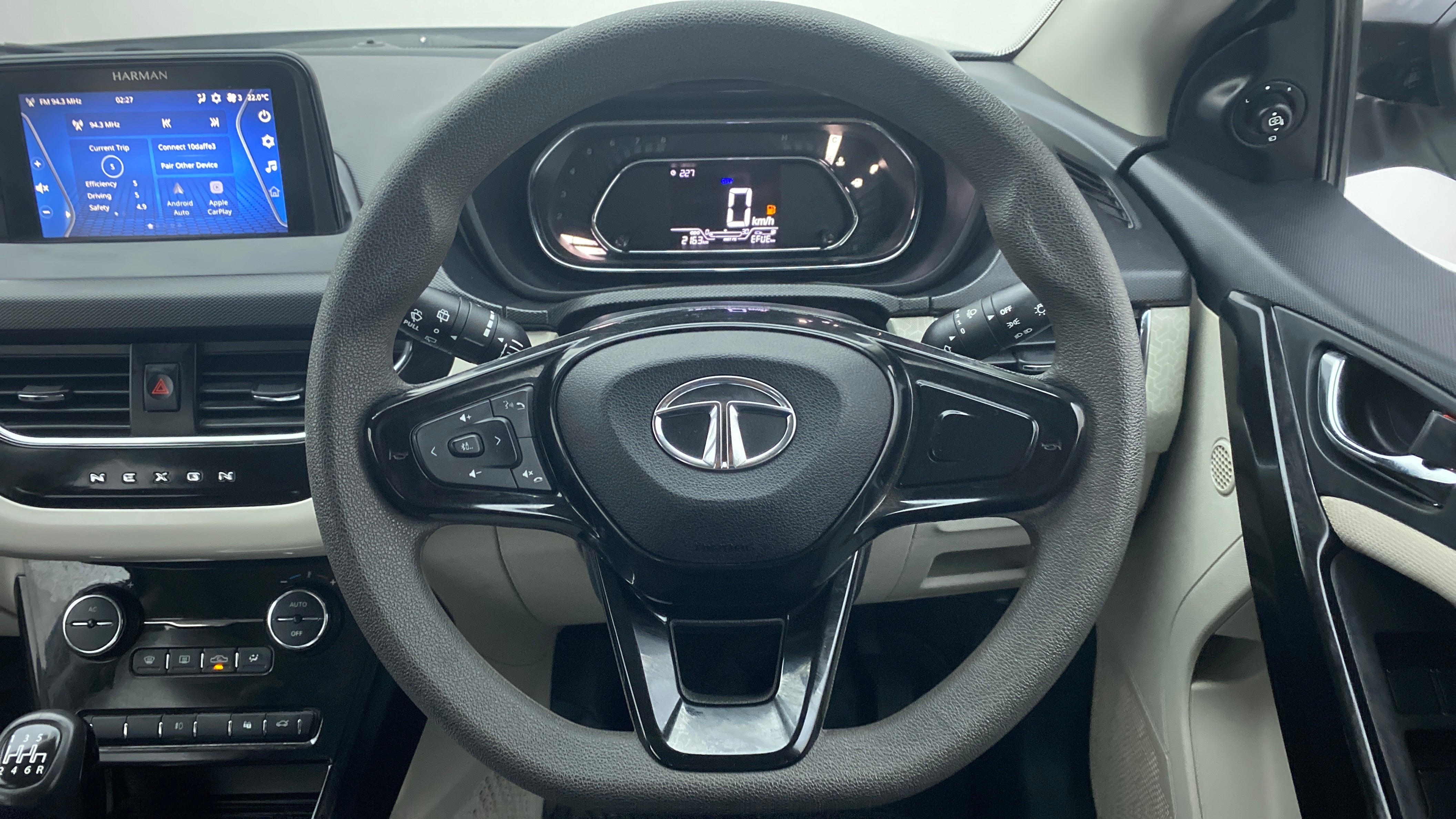 Steering wheel and dashboard view of a Tata Nexon 2017-2023