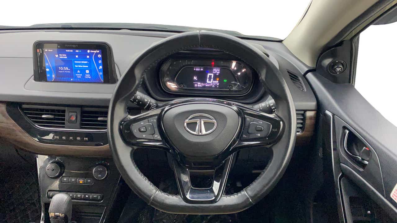Dashboard and steering wheel view of a Tata Nexon 2017-2023