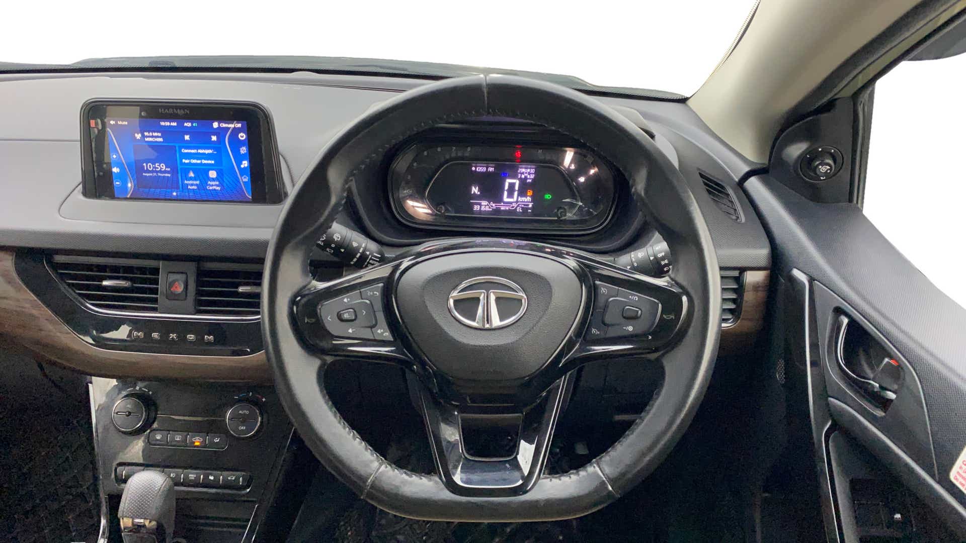 Dashboard and steering wheel view of a Tata Nexon 2017-2023