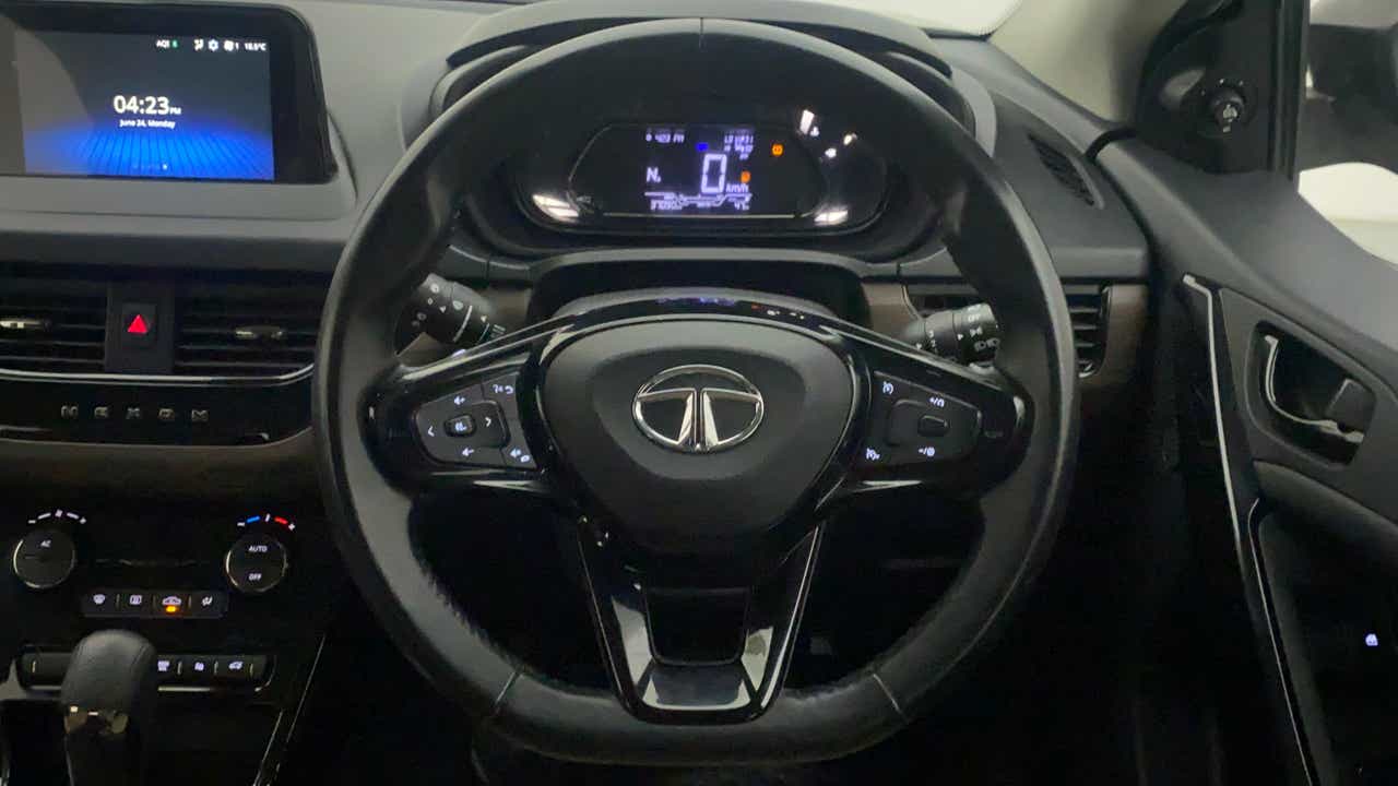 Interior dashboard and steering wheel of a Tata Nexon 2017-2023