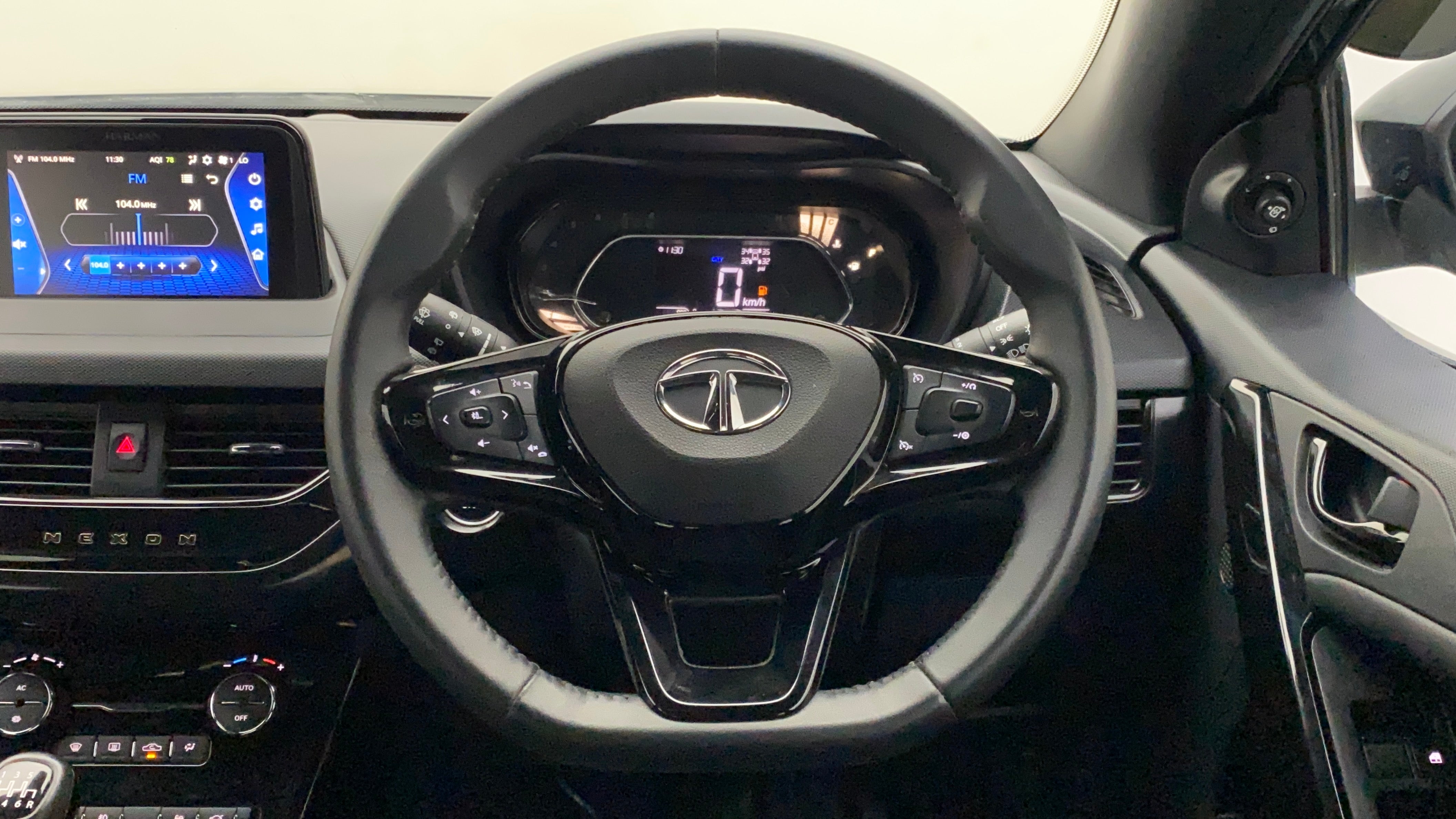 Steering wheel and dashboard view of a Tata Nexon 2017-2023