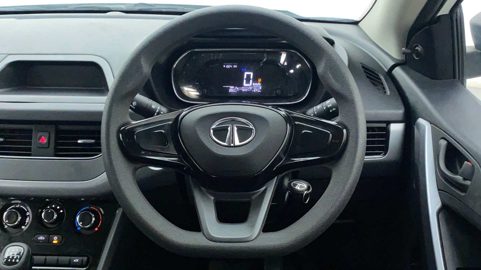 Interior dashboard and steering wheel of a Tata Nexon 2017-2023