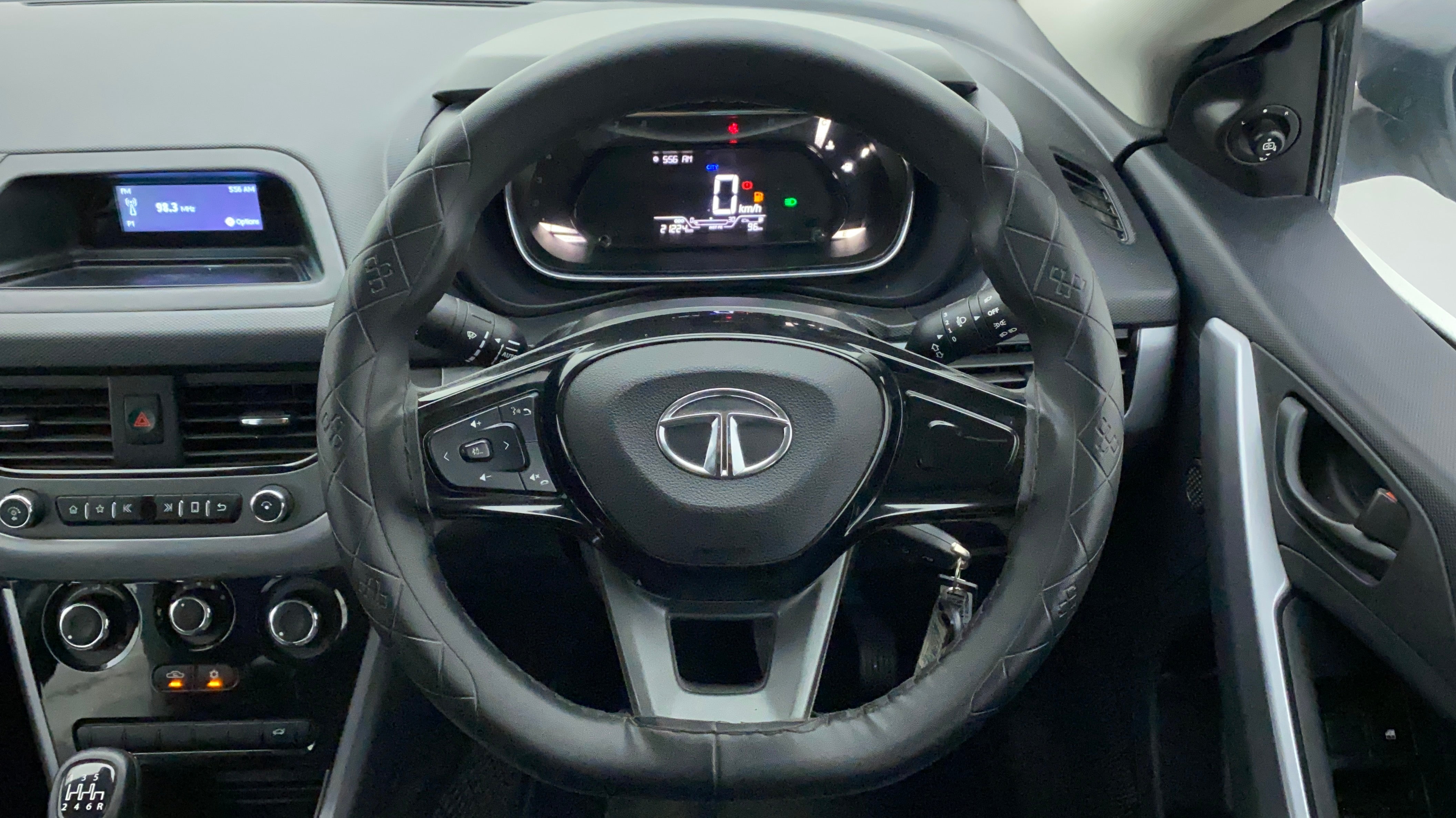 Steering wheel and dashboard view of a Tata Nexon 2017-2023