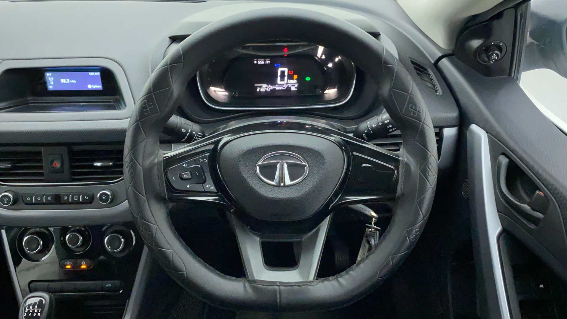 Steering wheel and dashboard view of a Tata Nexon 2017-2023