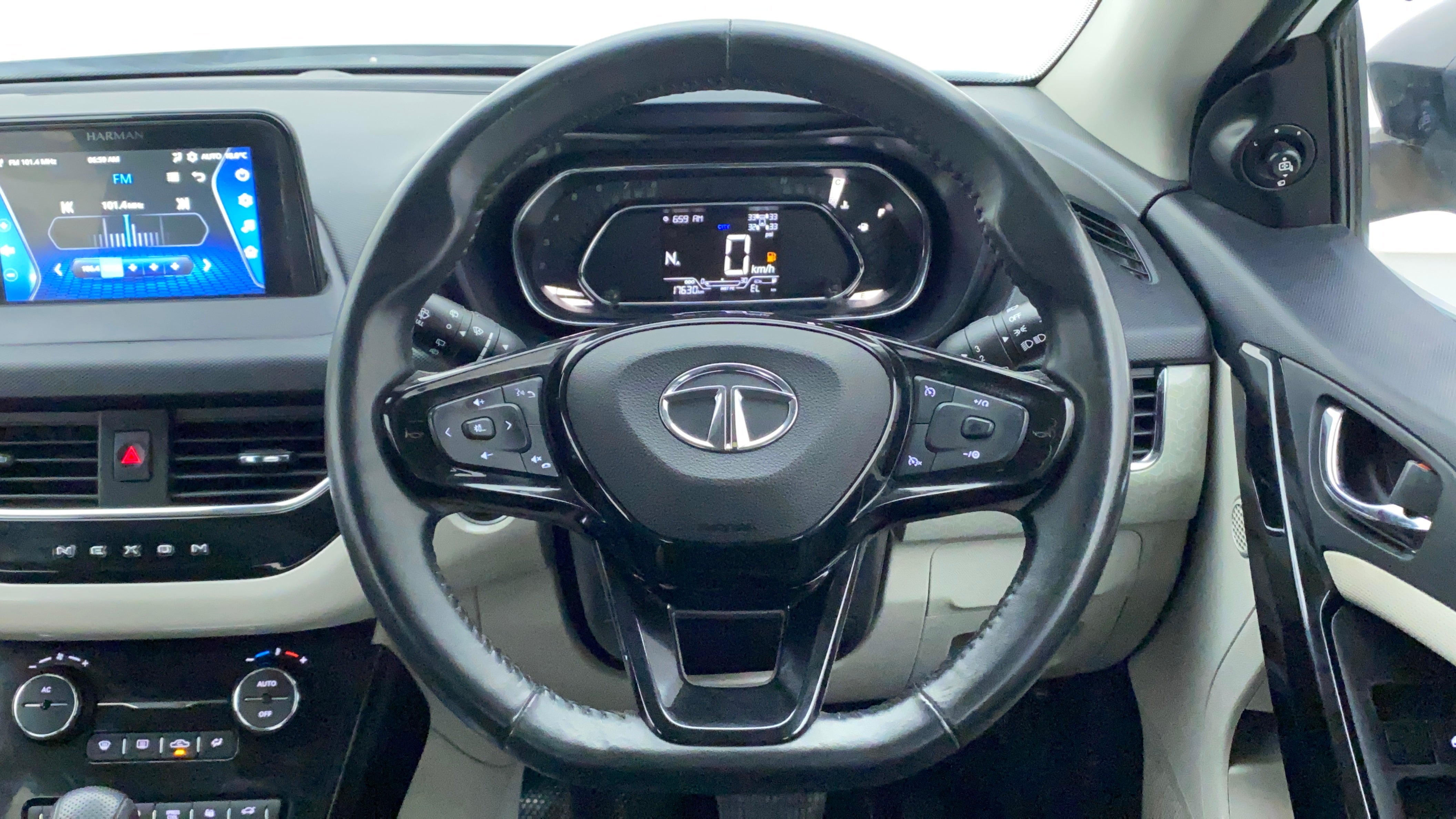 Steering wheel and dashboard view of a Tata Nexon 2017-2023