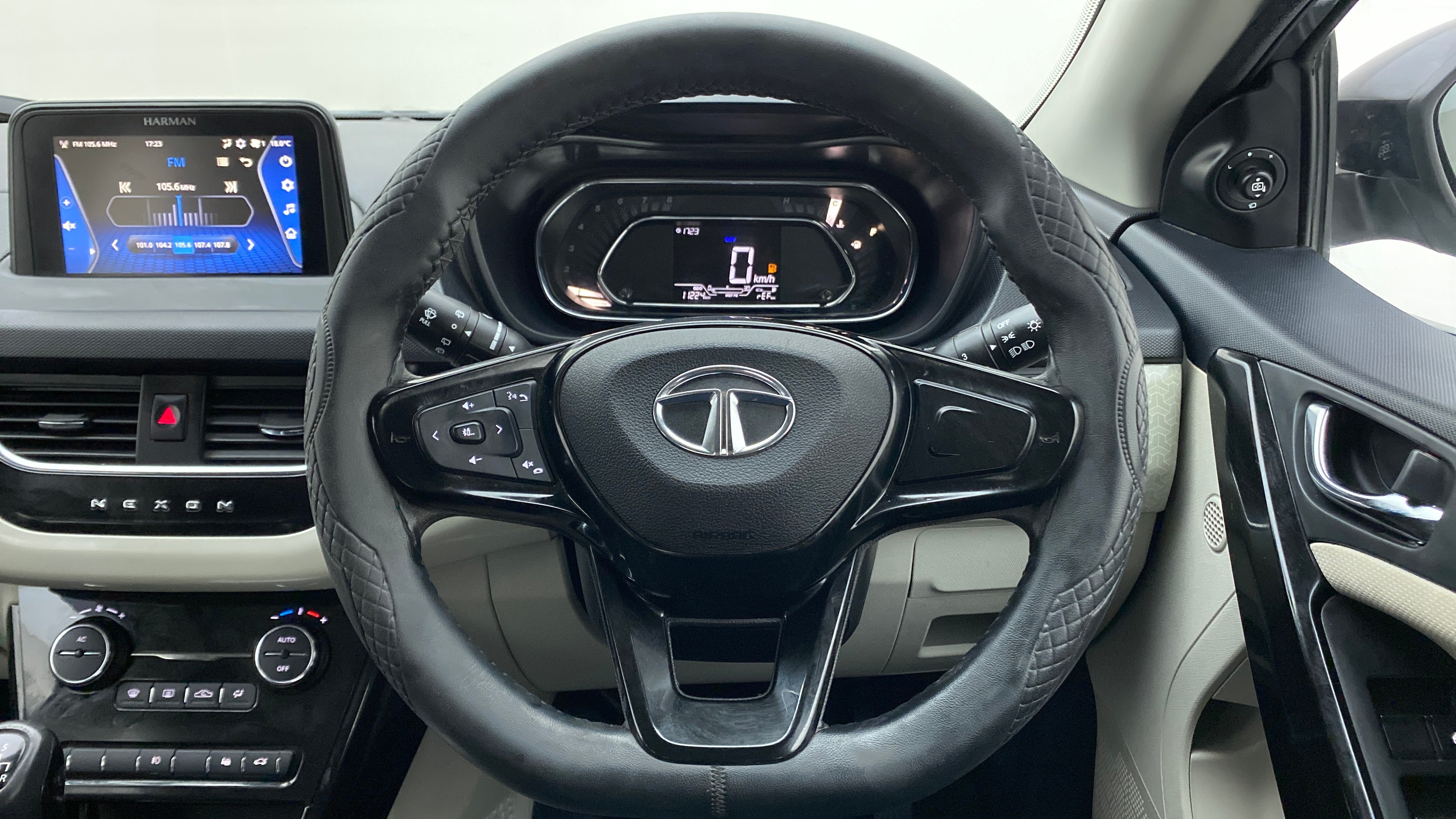 Steering wheel and dashboard view of a Tata Nexon 2017-2023