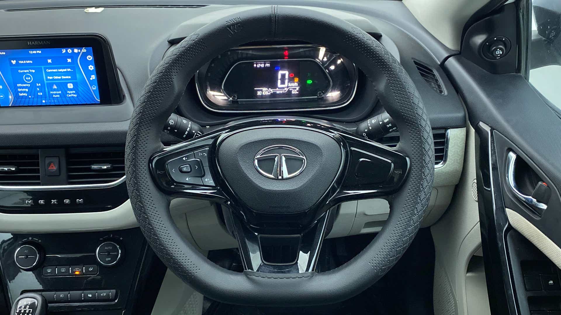 Interior dashboard and steering wheel of a Tata Nexon 2017-2023