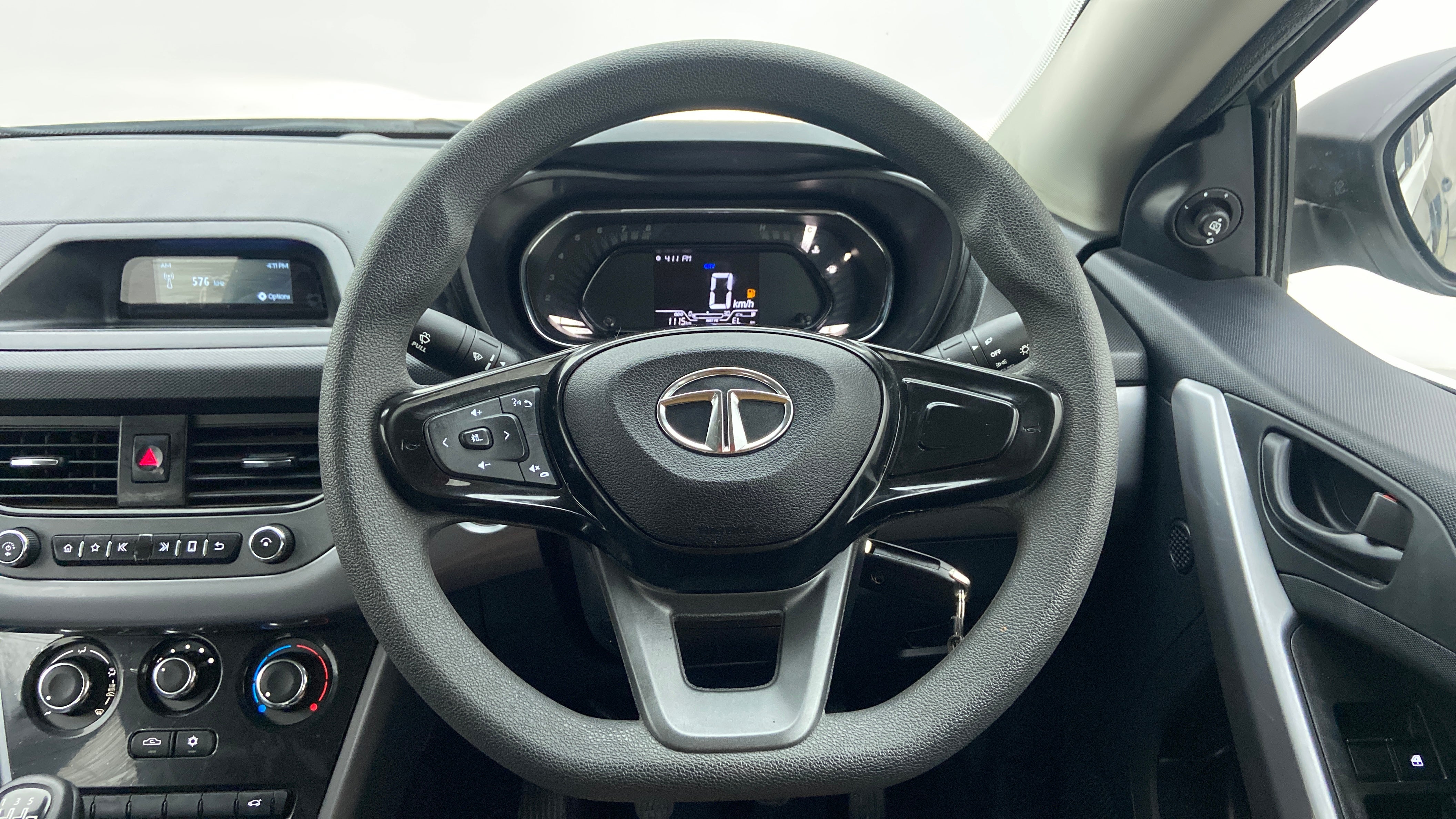 Steering wheel and dashboard view of a Tata Nexon 2017-2023