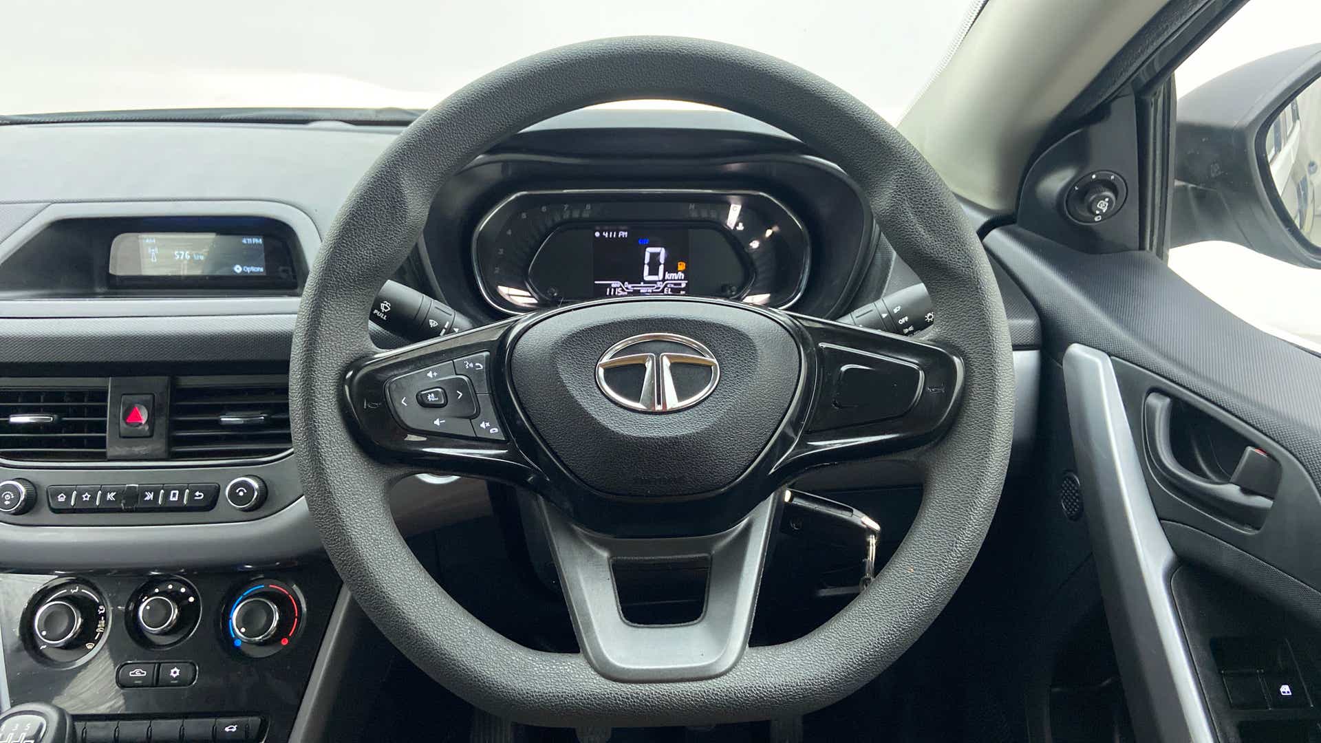Steering wheel and dashboard view of a Tata Nexon 2017-2023