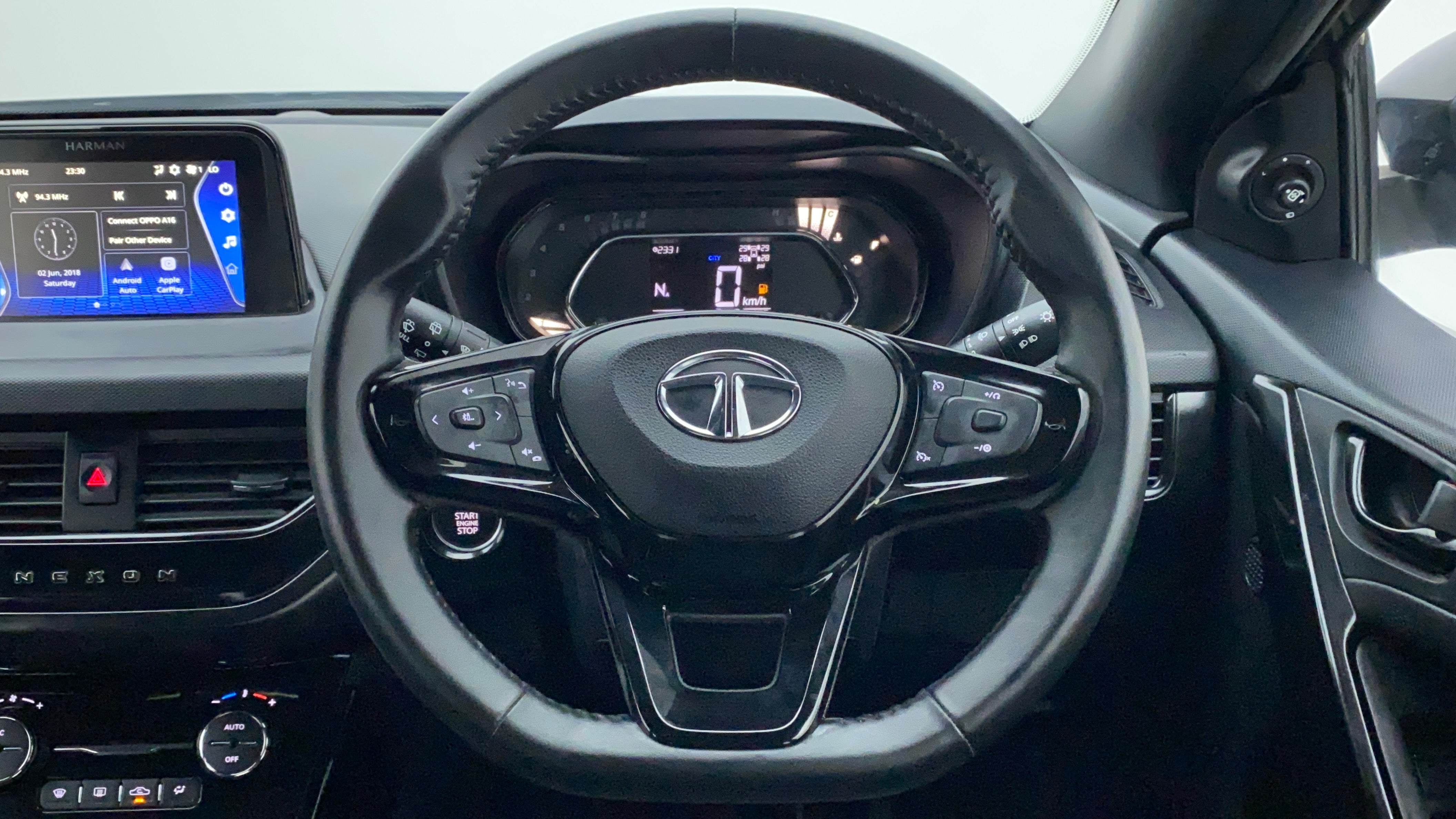 Steering wheel and dashboard view of a Tata Nexon 2017-2023
