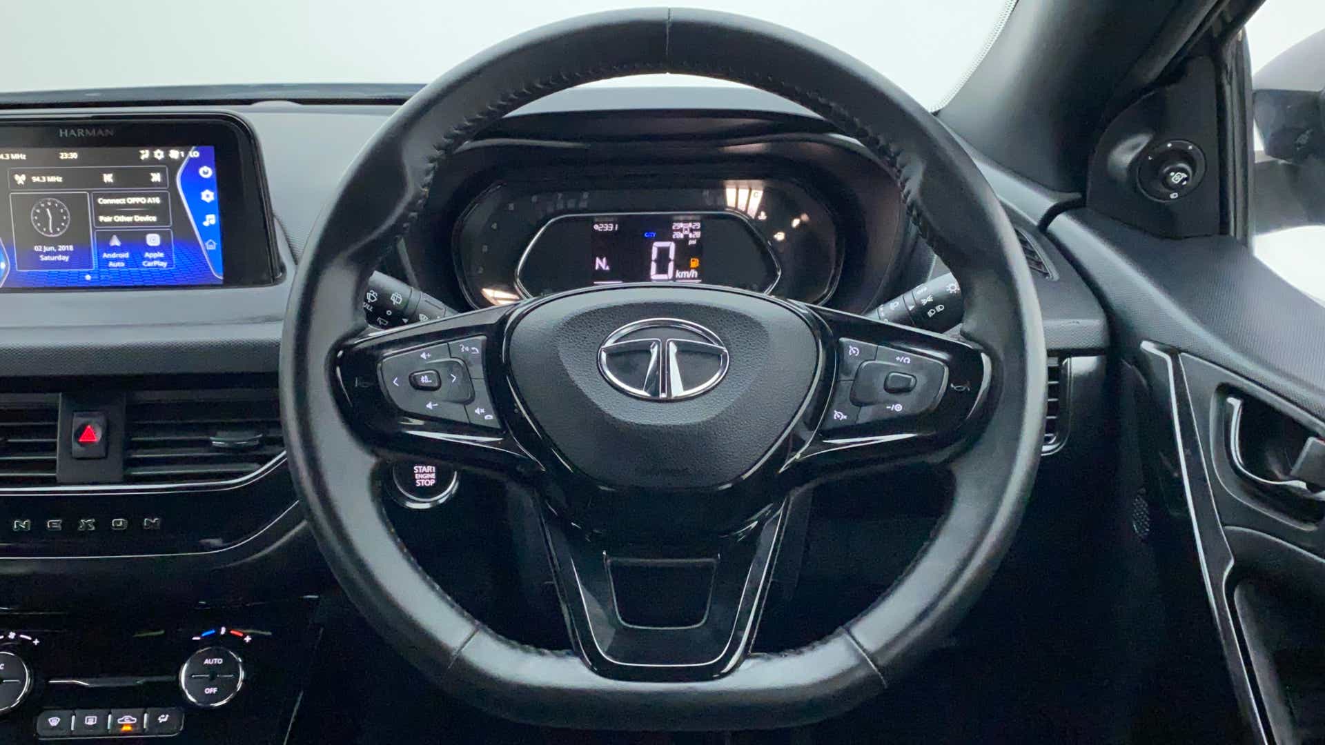 Steering wheel and dashboard view of a Tata Nexon 2017-2023