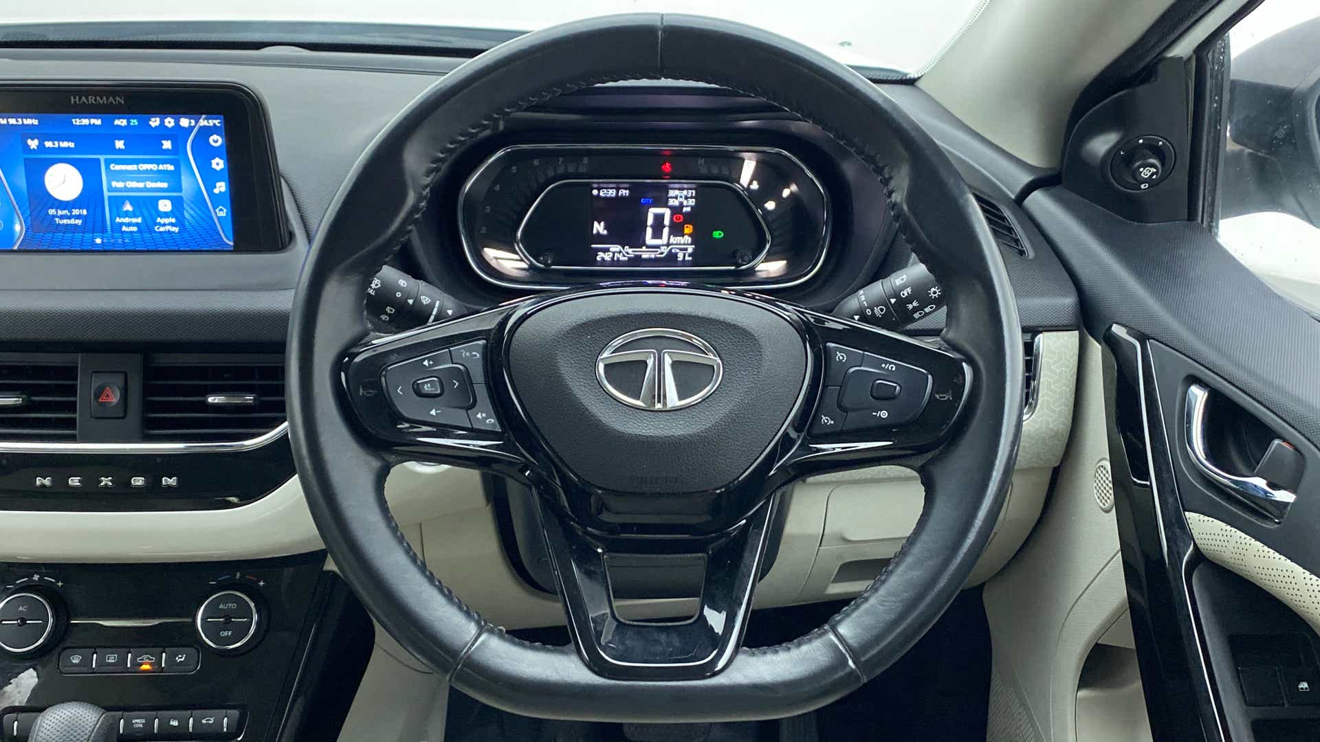 Interior dashboard and steering wheel of a Tata Nexon 2017-2023