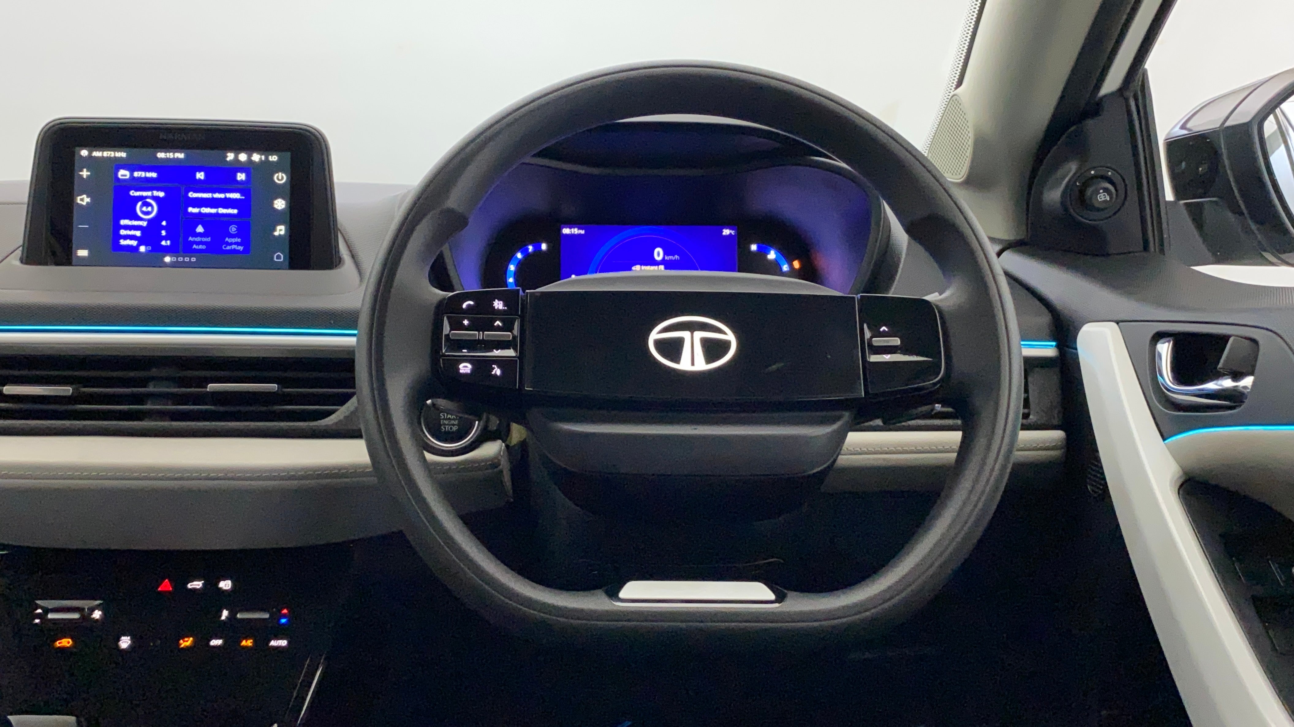 Interior dashboard and steering wheel of a Tata Nexon