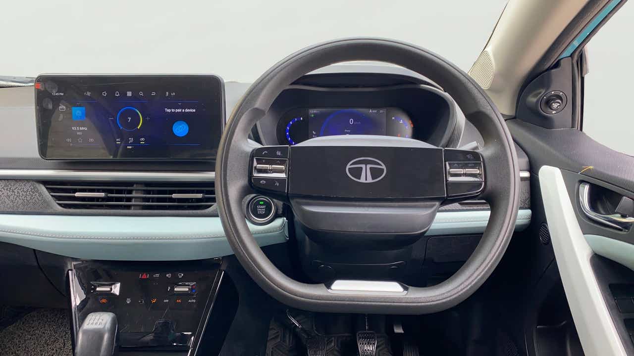 Dashboard and steering wheel view of a Tata Nexon