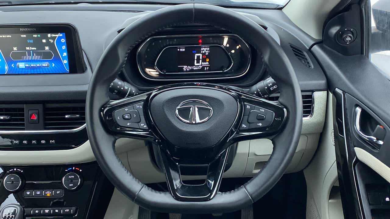 Steering wheel and dashboard view of a Tata Nexon 2017-2023