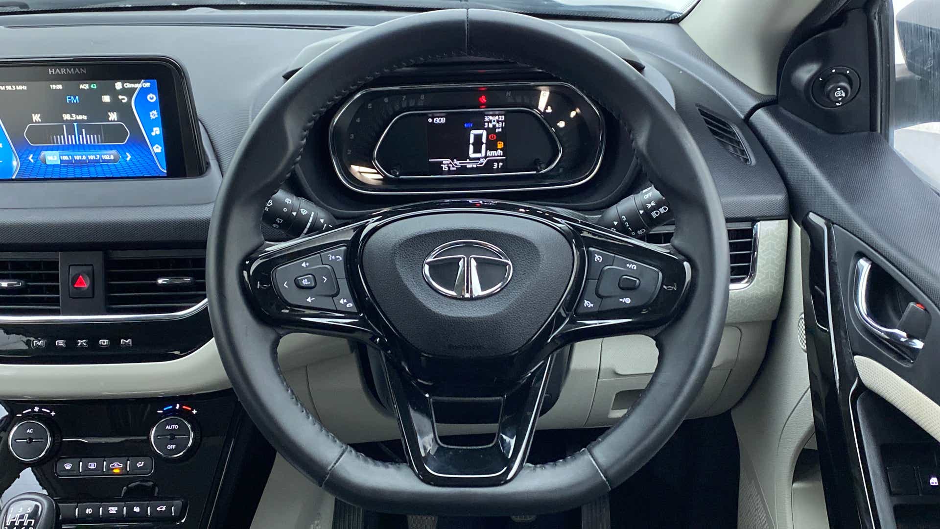 Steering wheel and dashboard view of a Tata Nexon 2017-2023