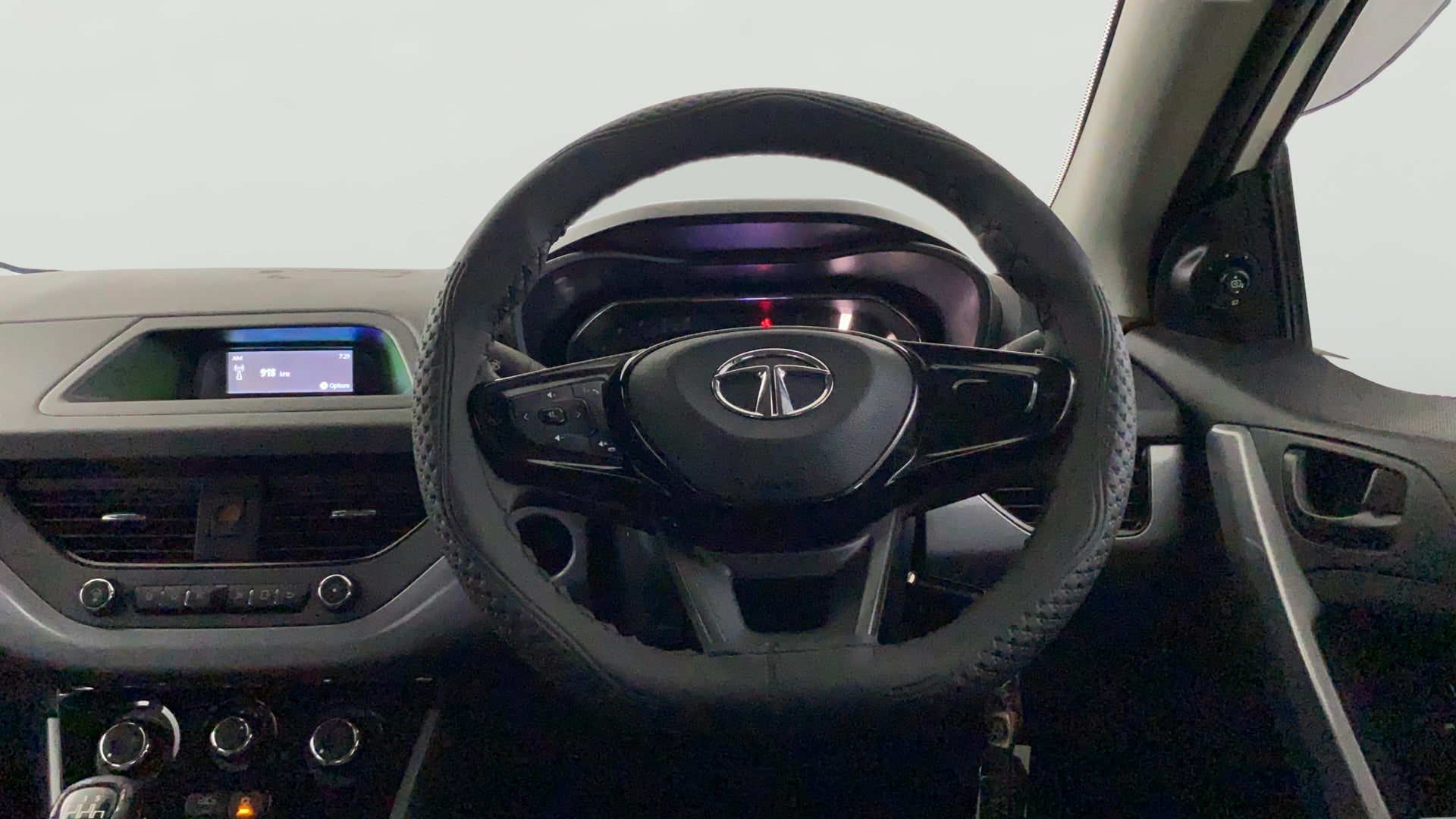 Dashboard and steering wheel view of a Tata Nexon 2017-2023