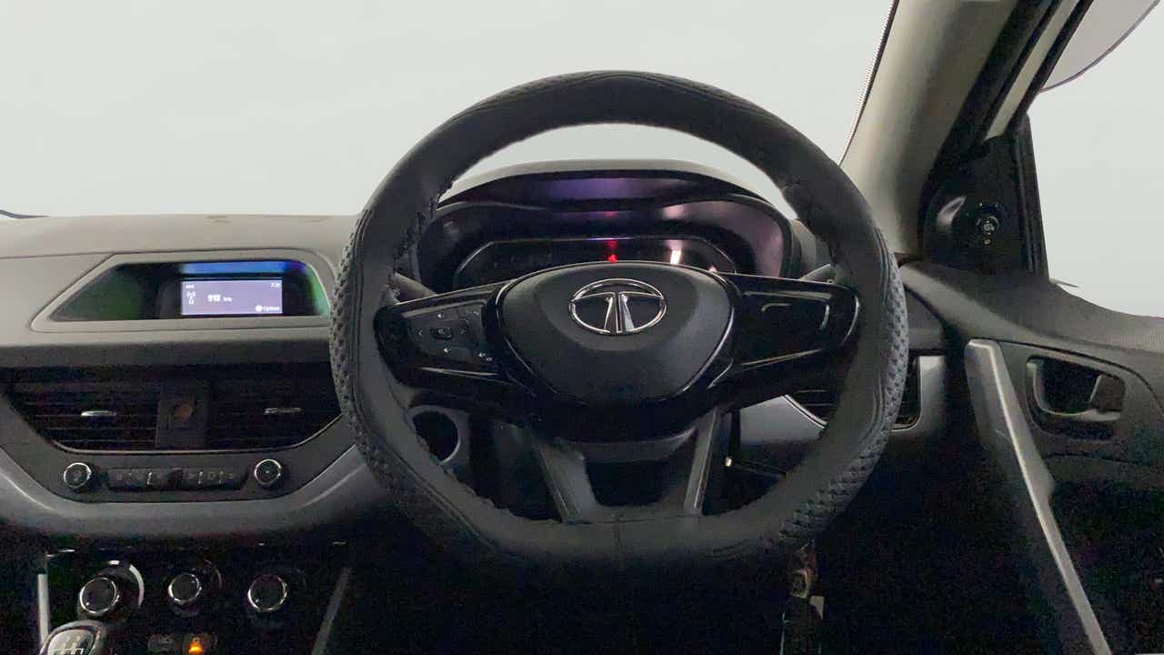 Dashboard and steering wheel view of a Tata Nexon 2017-2023