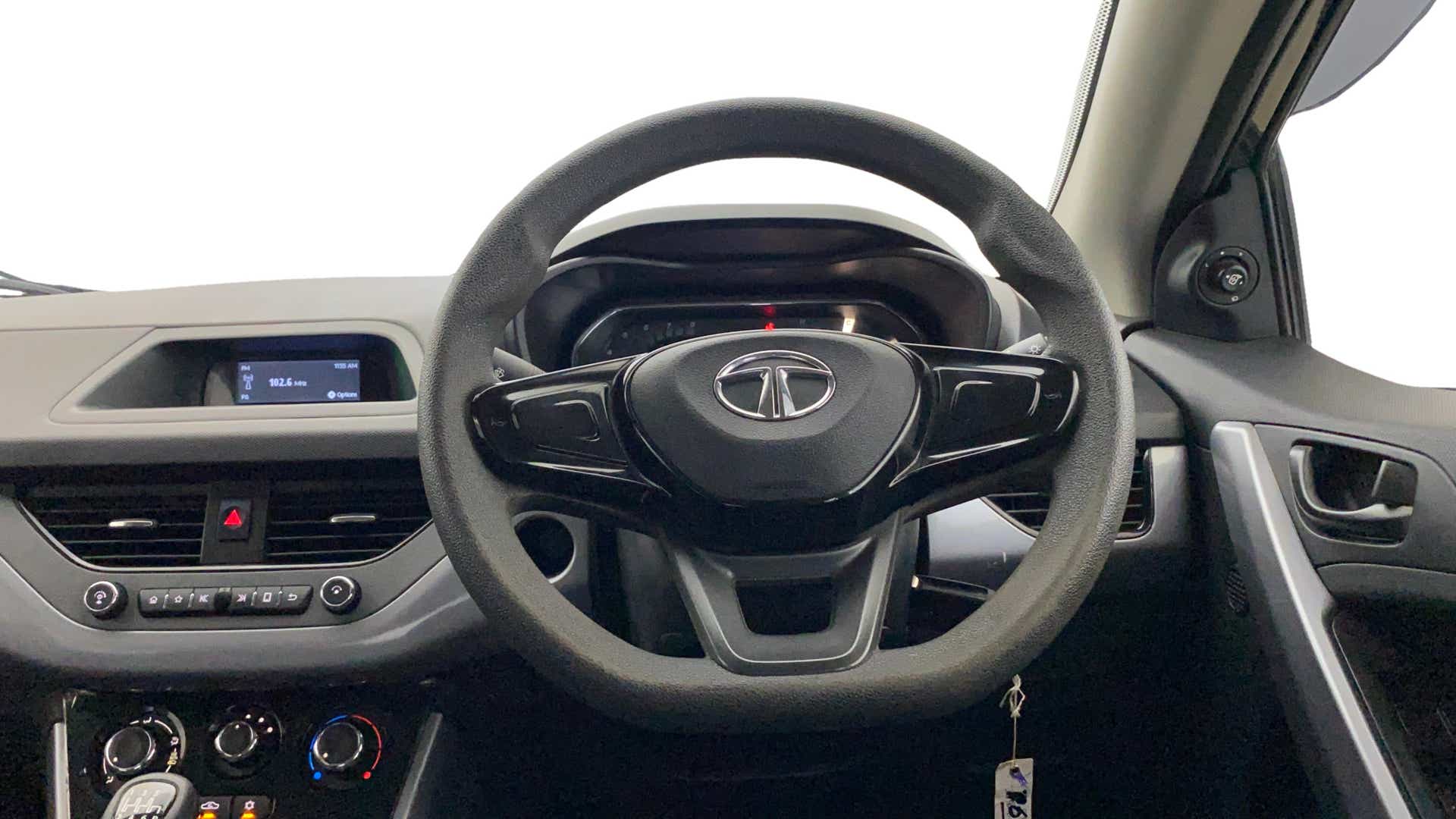 Interior dashboard and steering wheel of a Tata Nexon 2017-2023
