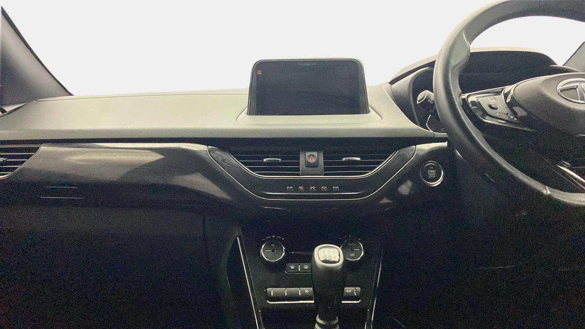 Dashboard and steering wheel view of a Tata Nexon 2017-2023