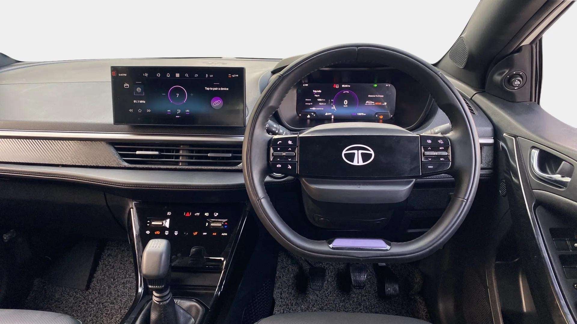 Dashboard and steering wheel view of a Tata Nexon 2017-2023