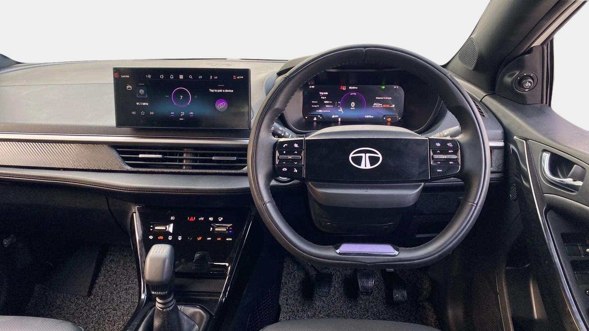 Dashboard and steering wheel view of a Tata Nexon 2017-2023