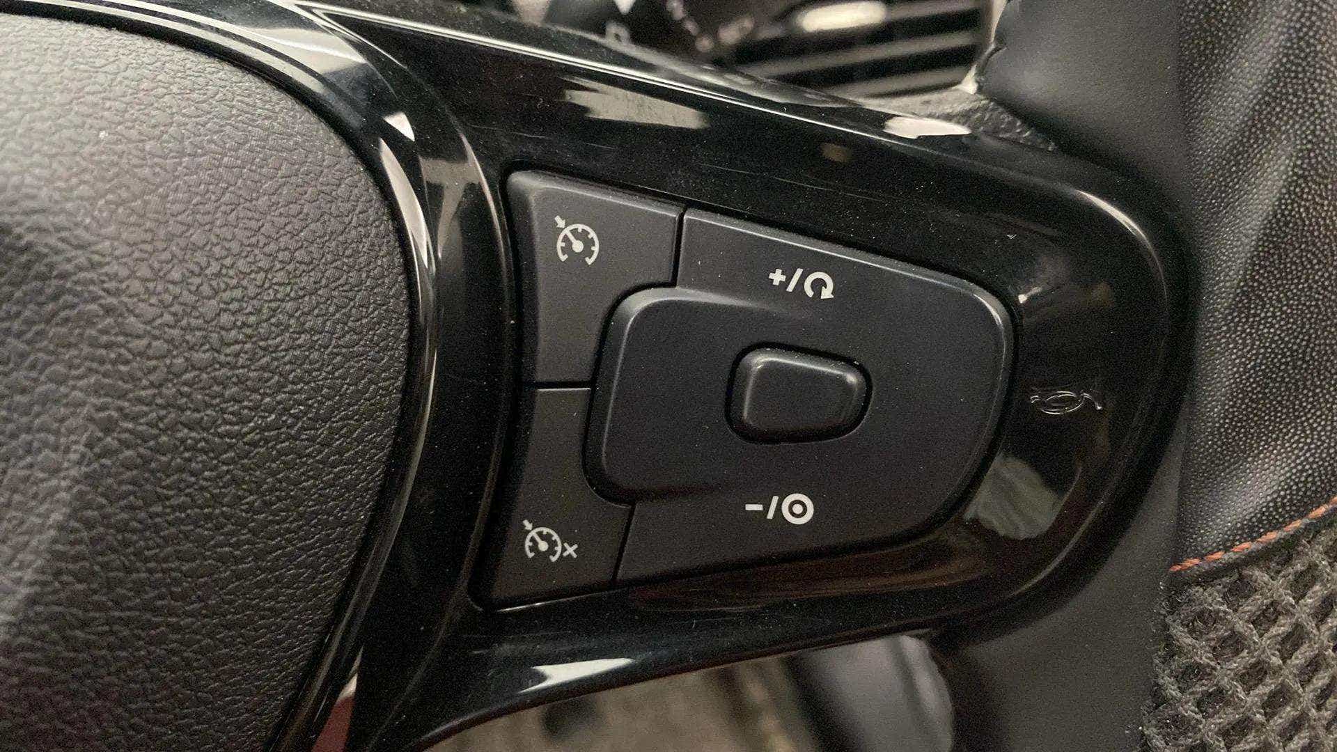 Steering wheel cruise control buttons of a Tata Nexon 2017-2023