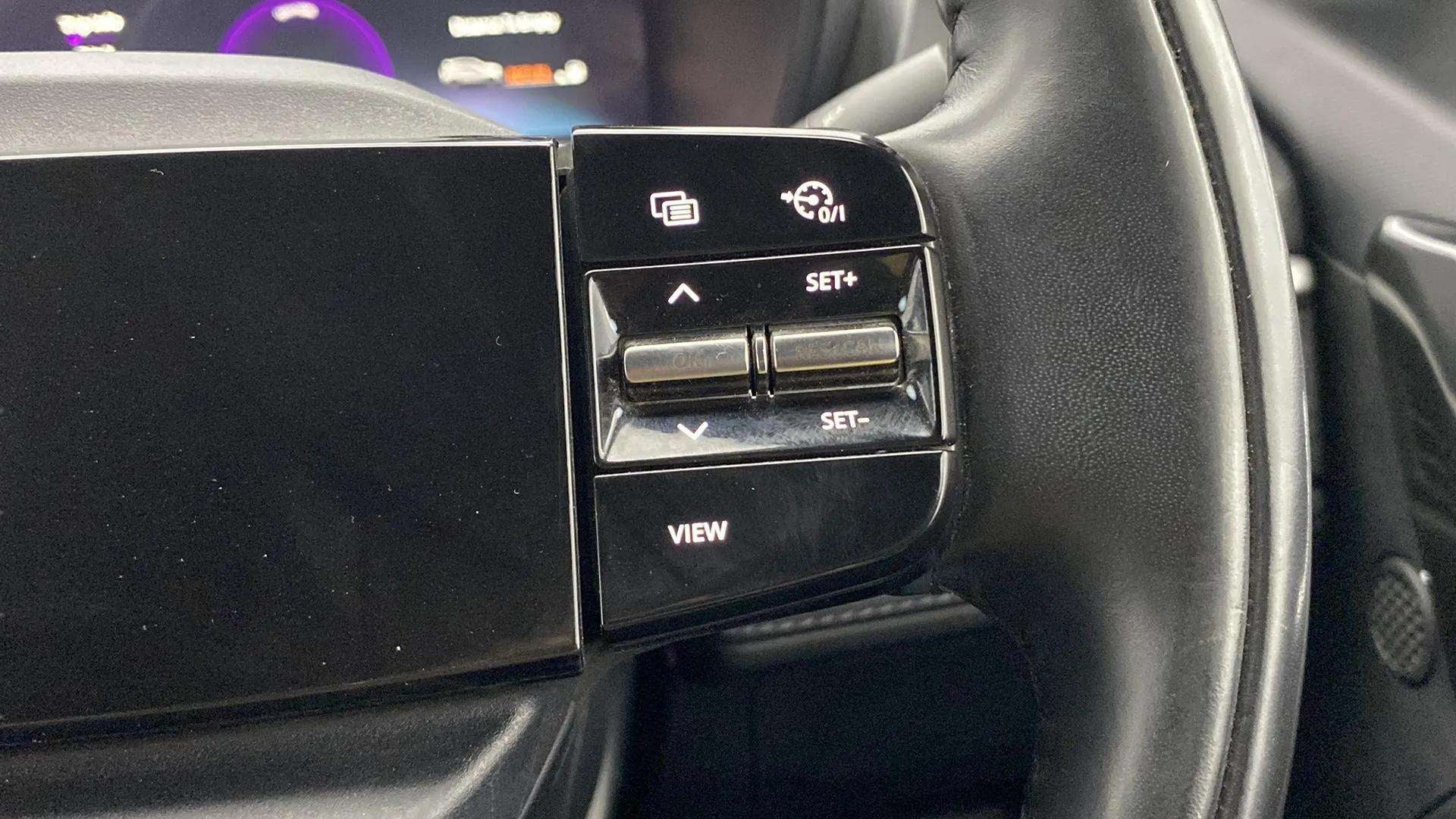 Steering wheel control close-up of a Tata Nexon 2017-2023