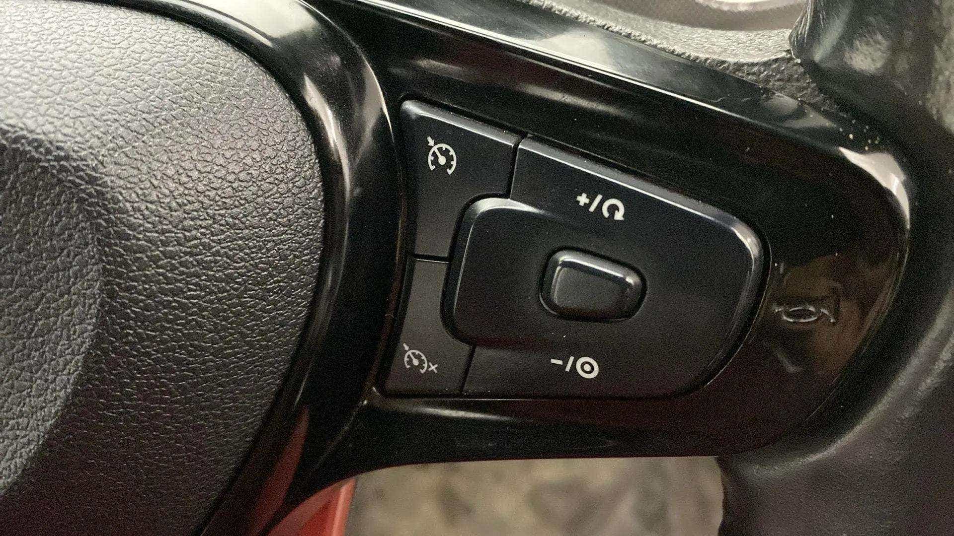 Steering wheel cruise control buttons of a Tata Nexon 2017-2023