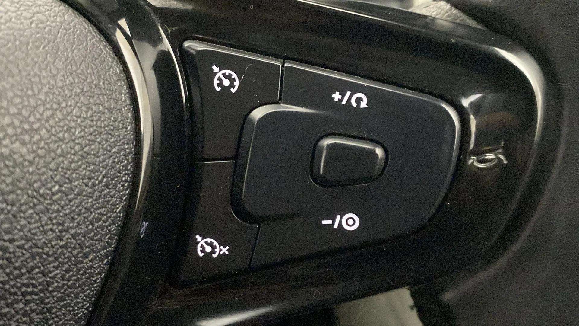 Steering wheel cruise control buttons of a Tata Nexon 2017-2023