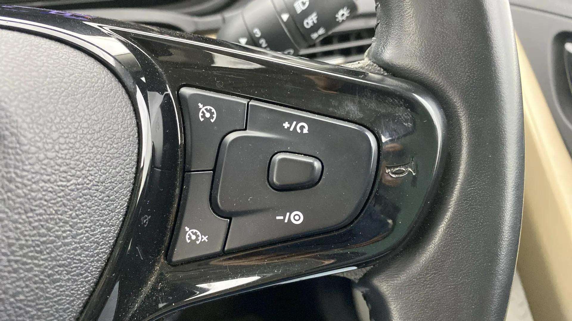 Steering wheel cruise control buttons of a Tata Nexon 2017-2023